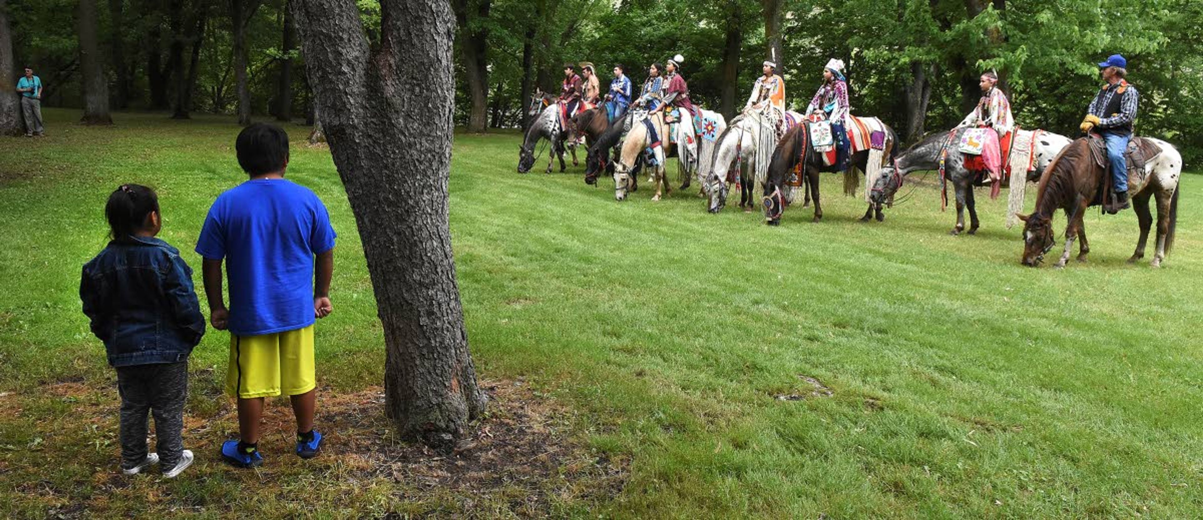 Appaloosa horses on parade was just part of the annual Nez Perce Tribal Culture Day at the Nez Perce National Historical Park on Saturday at Spalding, where Fadrea, 5, and Paris Morrison, 9, watched intently.