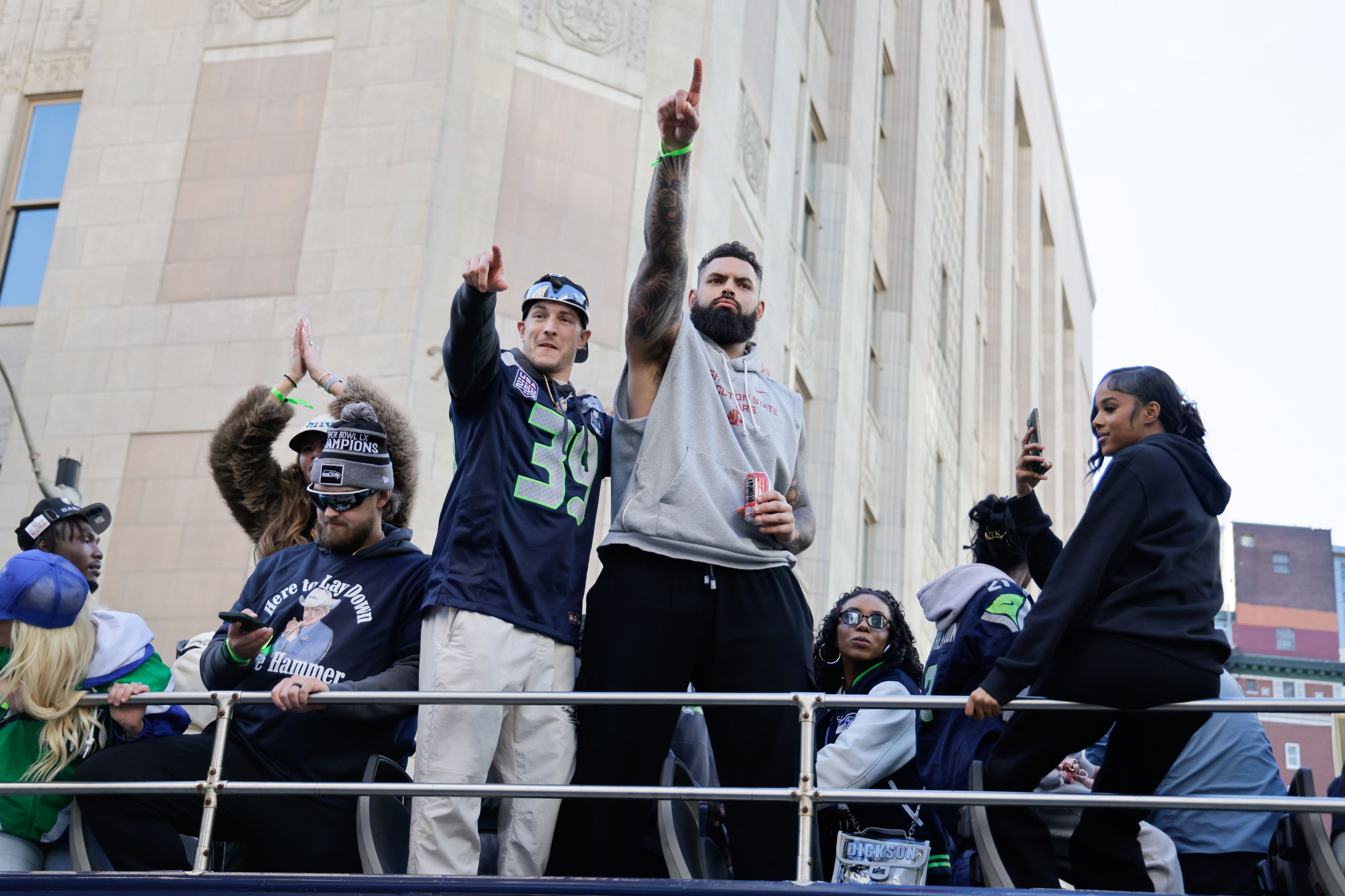 Seahawks players, including Washington State grad Abraham Lucas, center, take part in the team’s NFL Super Bowl LX parade and celebration Wednesday in Seattle.