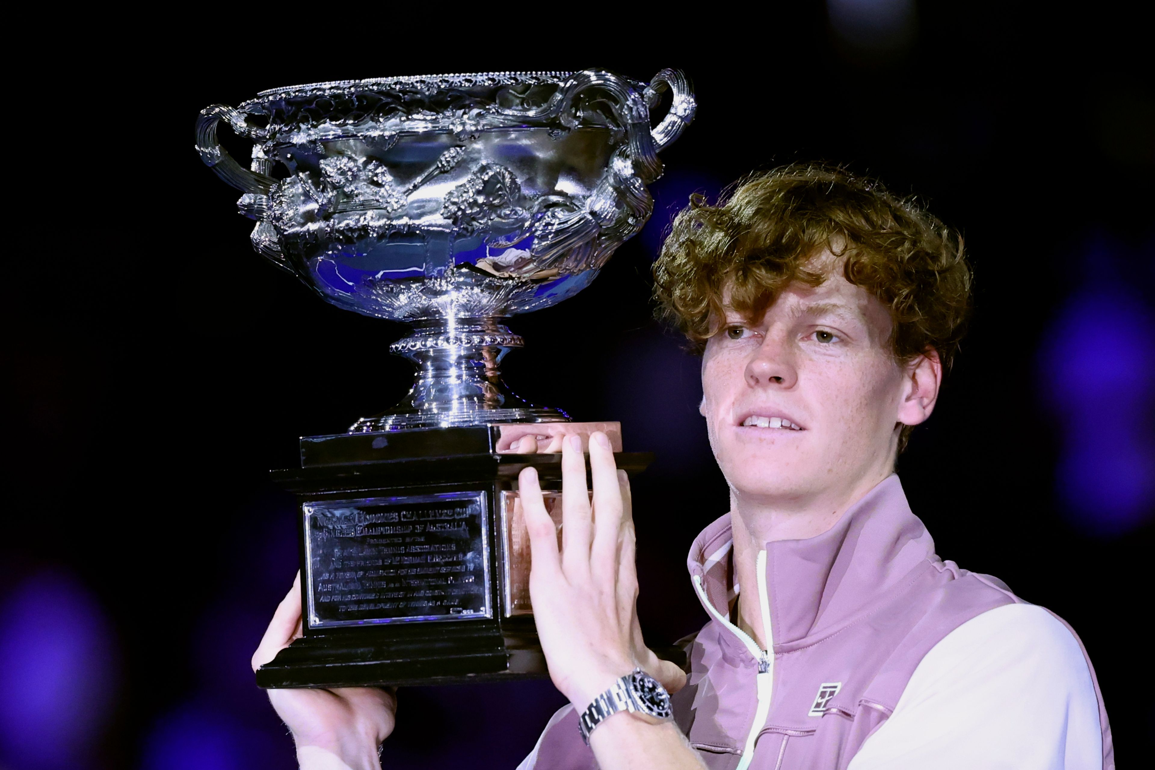 FILE - Jannik Sinner of Italy holds the Norman Brookes Challenge Cup aloft after defeating Daniil Medvedev of Russia in the men's singles final at the Australian Open tennis championships at Melbourne Park, in Melbourne, Australia, Sunday, Jan. 28, 2024. Sinner made his debut at No. 1 in the ATP rankings on Monday, June 10, moving up one spot to replace the injured Novak Djokovic.