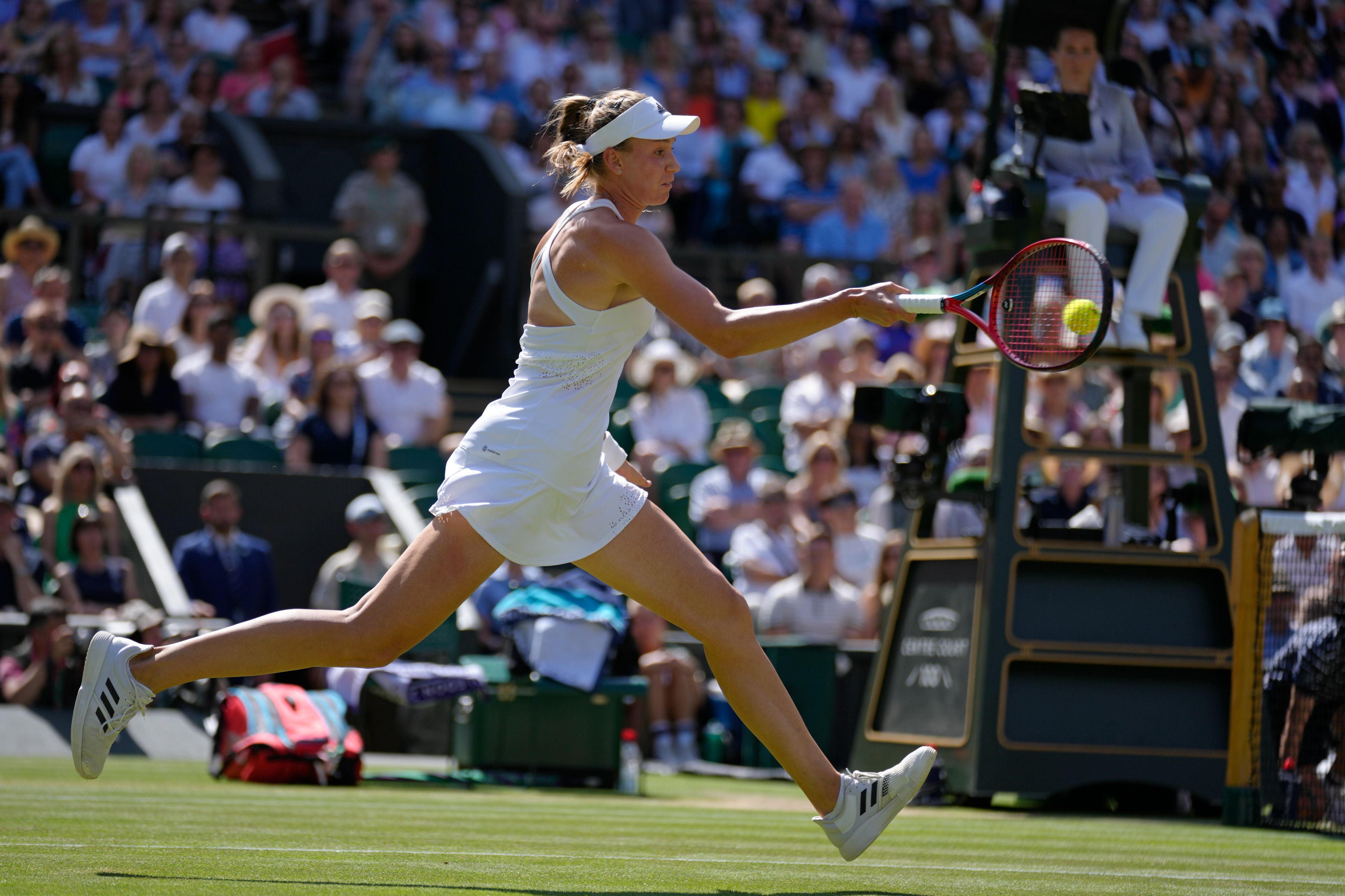 Kazakhstan's Elena Rybakina returns to Tunisia's Ons Jabeur in the final of the women's singles on day thirteen of the Wimbledon tennis championships in London, Saturday, July 9, 2022. (AP Photo/Kirsty Wigglesworth)