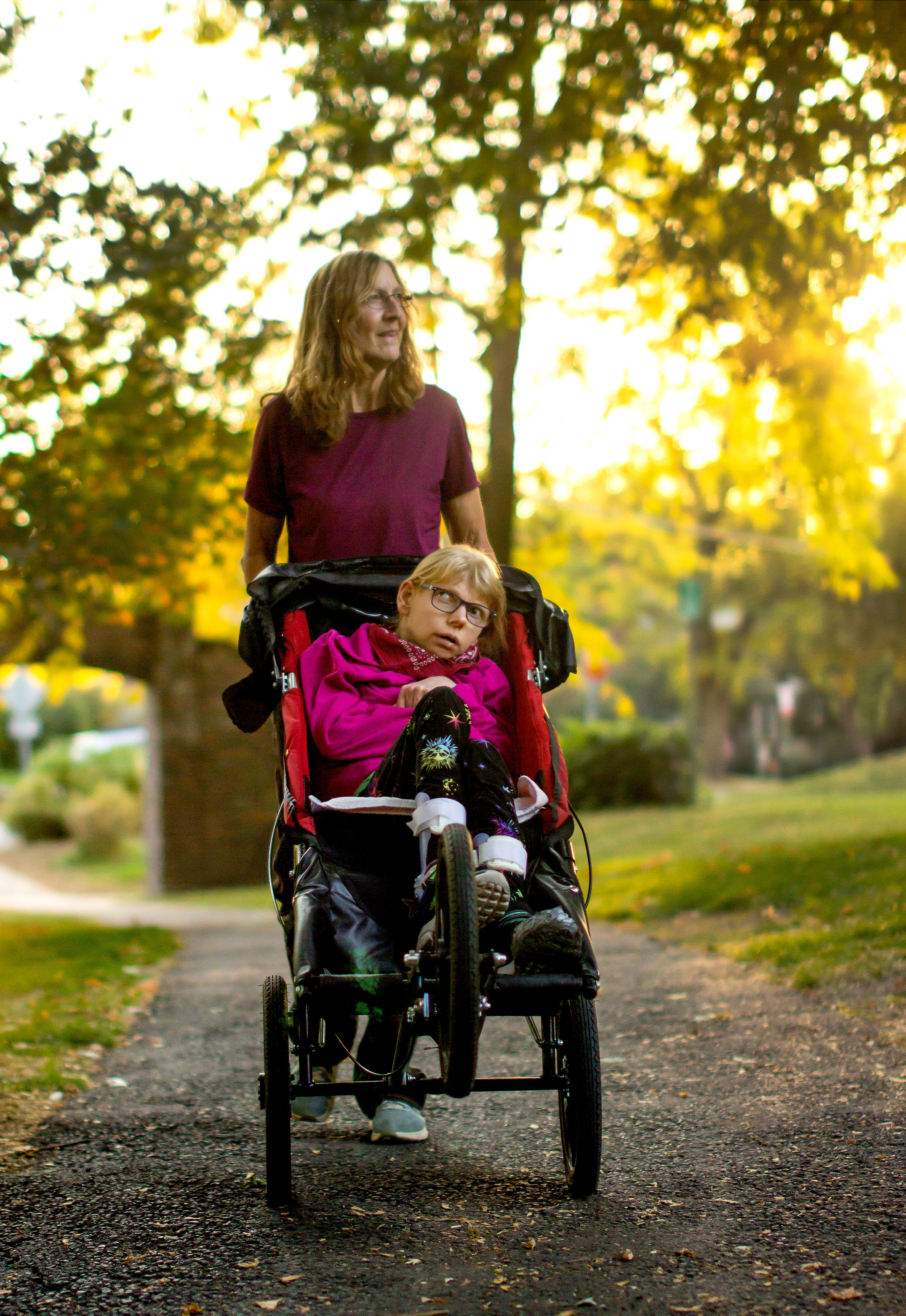 Lorie Ewing pushes Becca Ewing-Ford through East City Park in Moscow for a photo on Wednesday, Oct. 19.