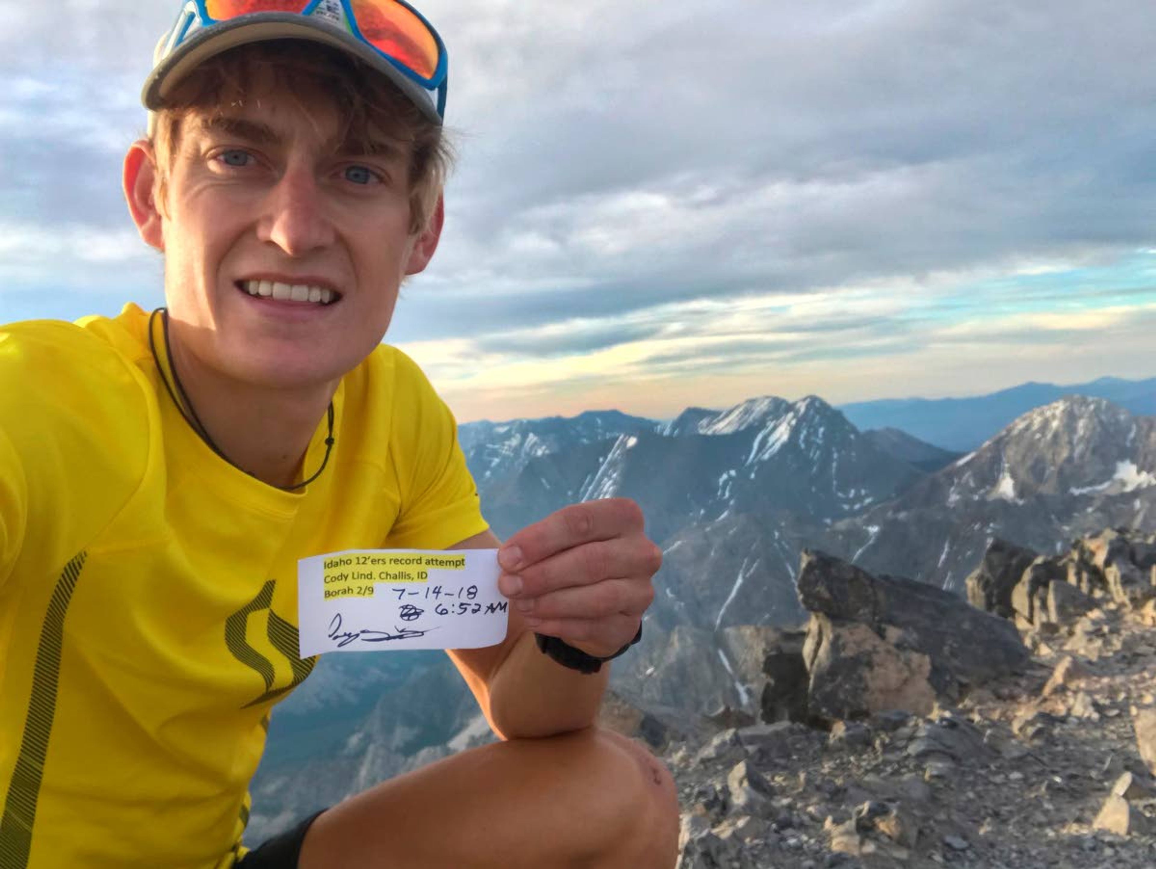 Ultra mountain runner Cody Lind pauses for a photo on the summit of Borah Peak during his record-setting climb of all of Idaho’s 12,000-foot peaks.