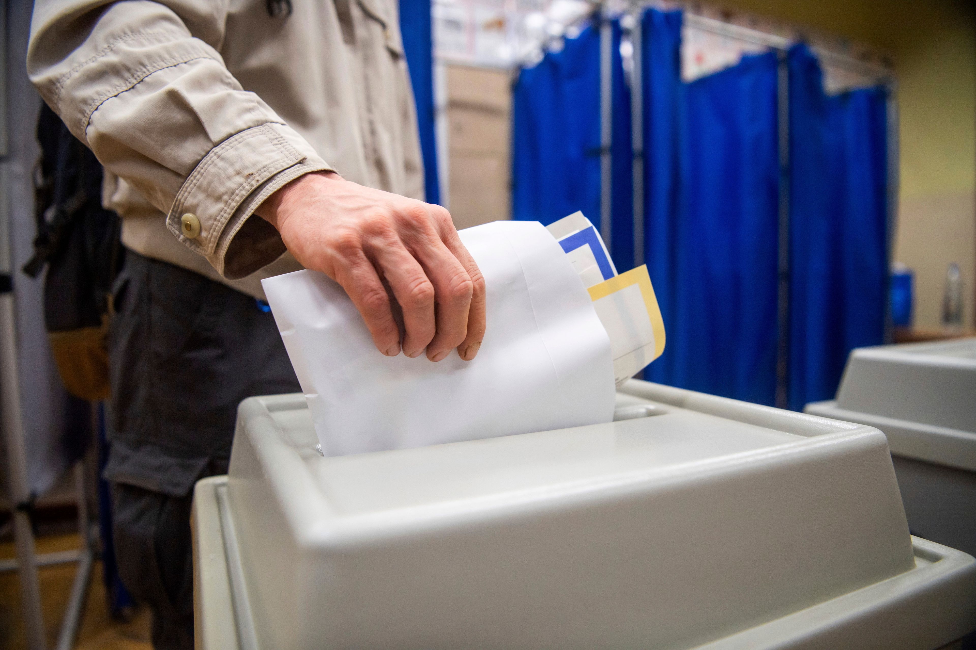 A man votes at a polling station during the European Parliament and the local elections in Budapest, Hungary, Sunday, June 9, 2024.