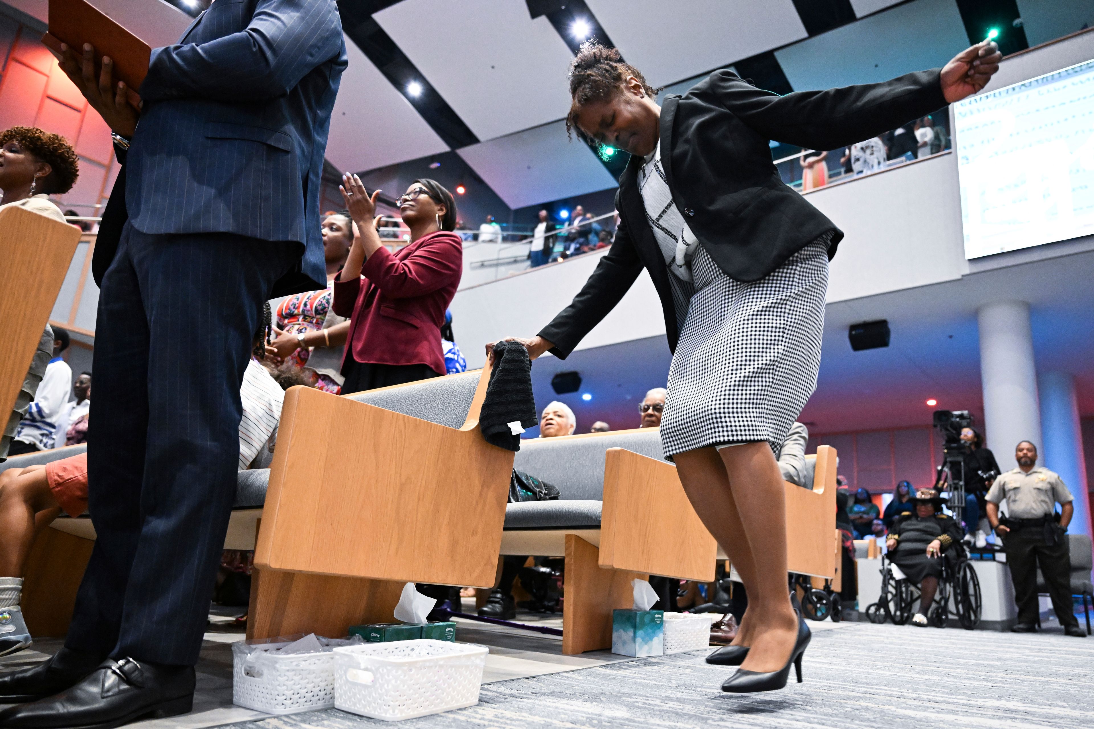 A woman dances in the aisle during church service at Kingdom Fellowship AME Church, Sunday, June 2, 2024, in Calverton, Md. The suburban Maryland congregation, led by the Rev. Matthew L. Watley, has landed at the top of a list of the fastest-growing churches in America.