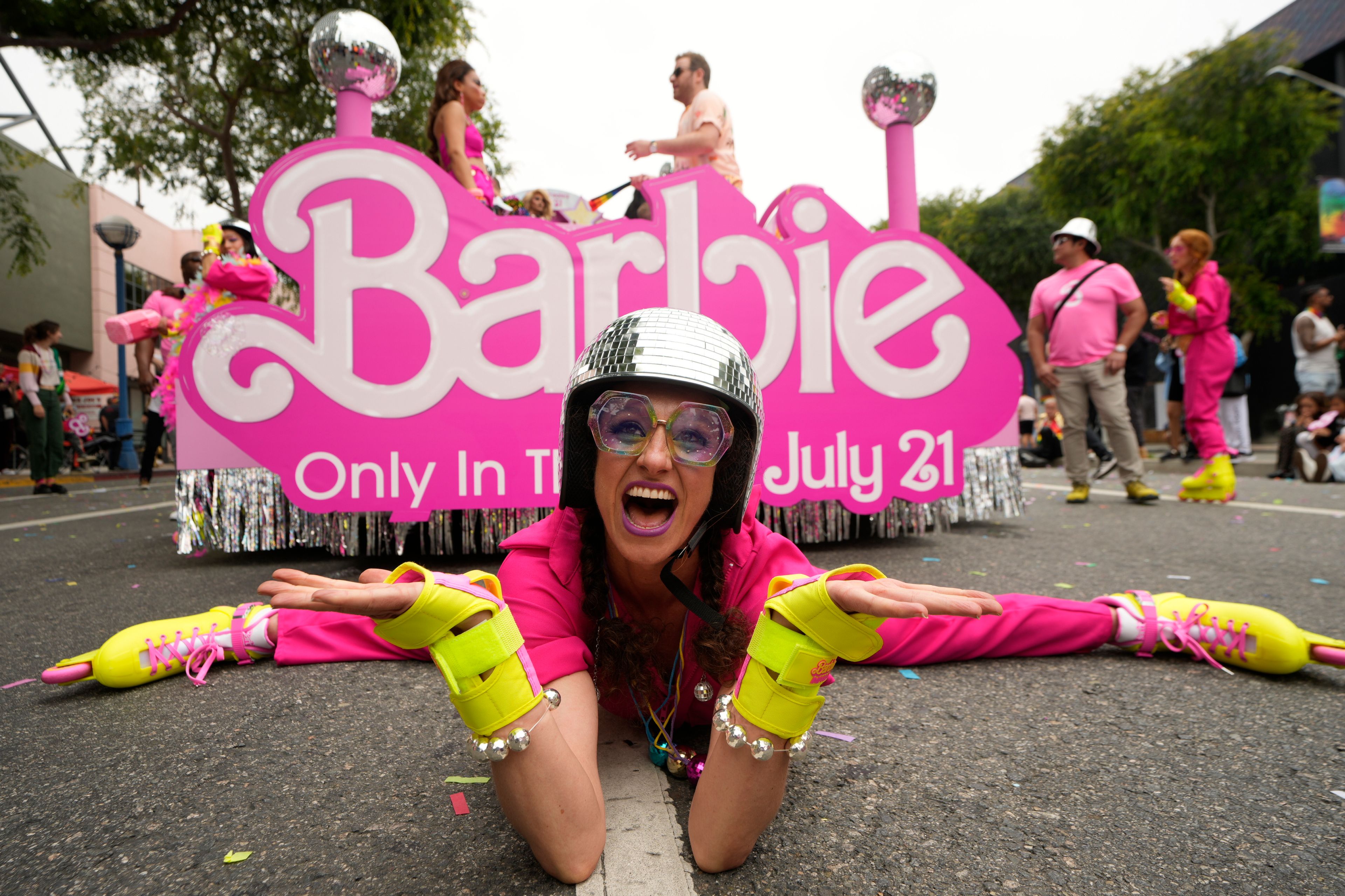 Dancer Kim Manning performs a routine to promote the film "Barbie" at the WeHo Pride Parade in West Hollywood, Calif., on Sunday, June 4, 2023. The "Barbie" film stars Margot Robbie and Ryan Gosling as Barbie and Ken, respectively. It opens in theaters on July 21. (AP Photo/Damian Dovarganes)