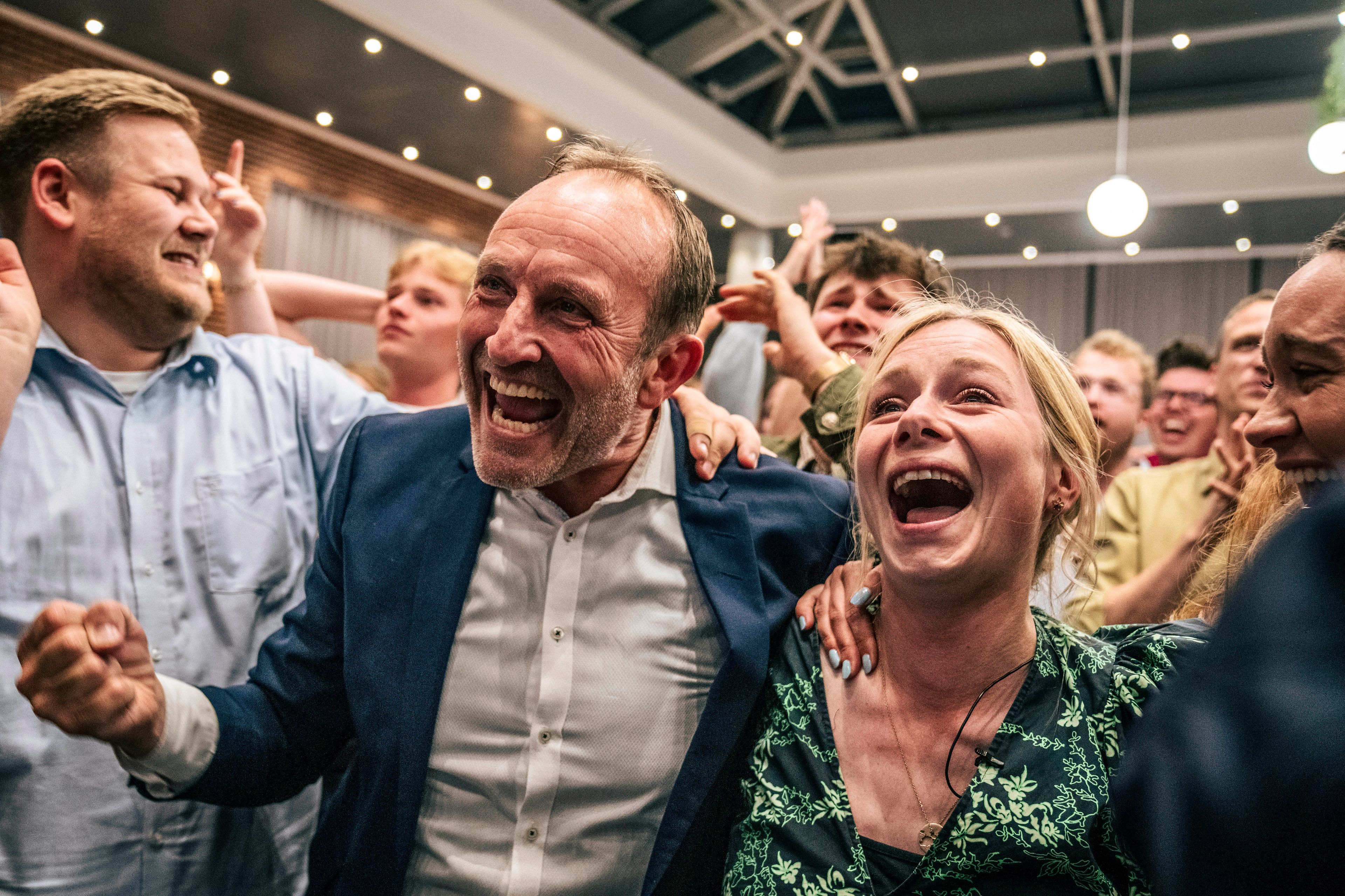 Sigrid Friis and Martin Lidegaard, of the Social Liberal Party, celebrate at an election party at Green Power Denmark in Copenhagen, Sunday, June 9, 2024.