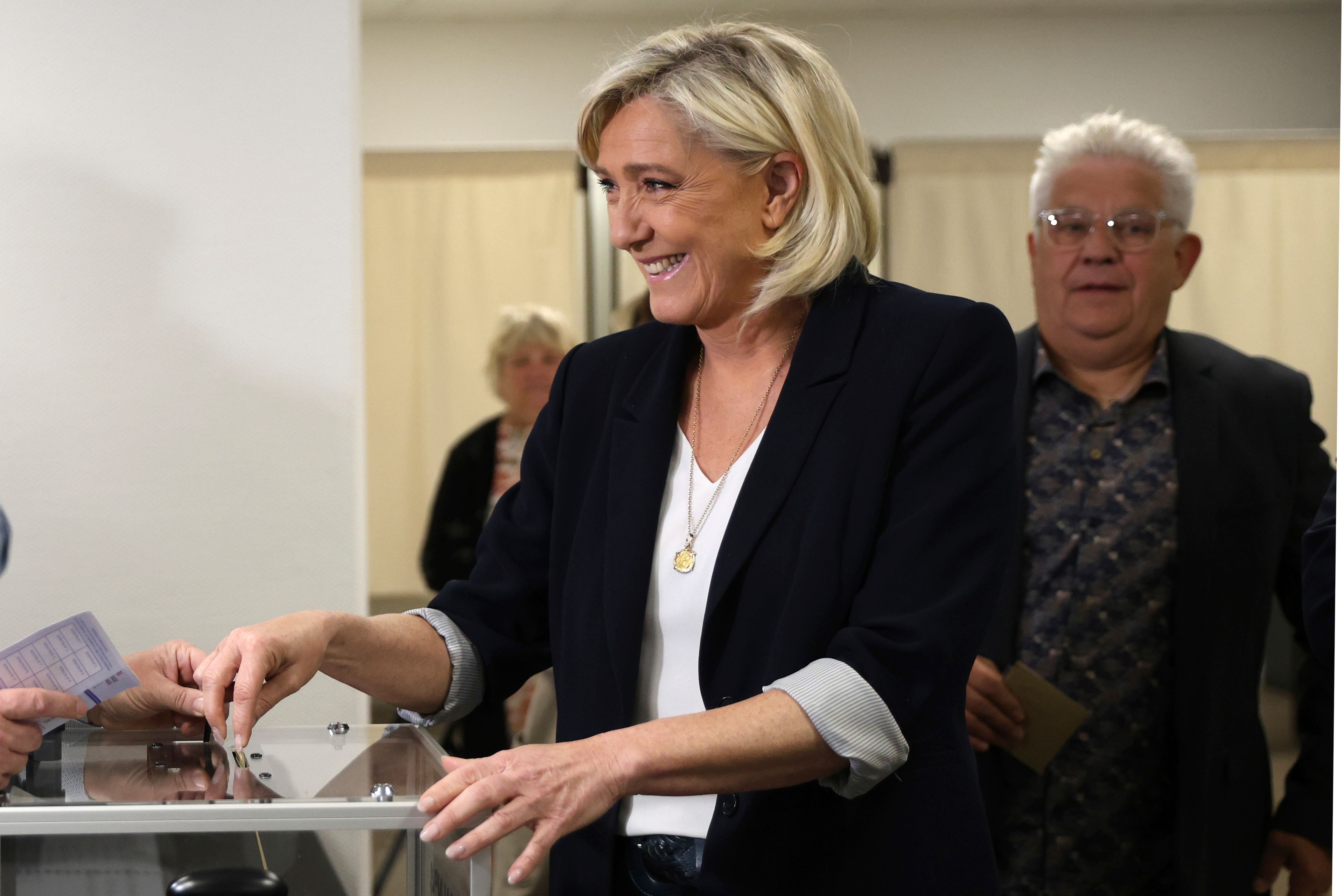 French far-right leader Marine Le Pen casts her ballot to vote for the European election, Sunday, June 9, 2024 in Henin-Beaumont, northern France. Polling stations opened across Europe on Sunday as voters from 20 countries cast ballots in elections that are expected to shift the European Union's parliament to the right and could reshape the future direction of the world's biggest trading bloc.