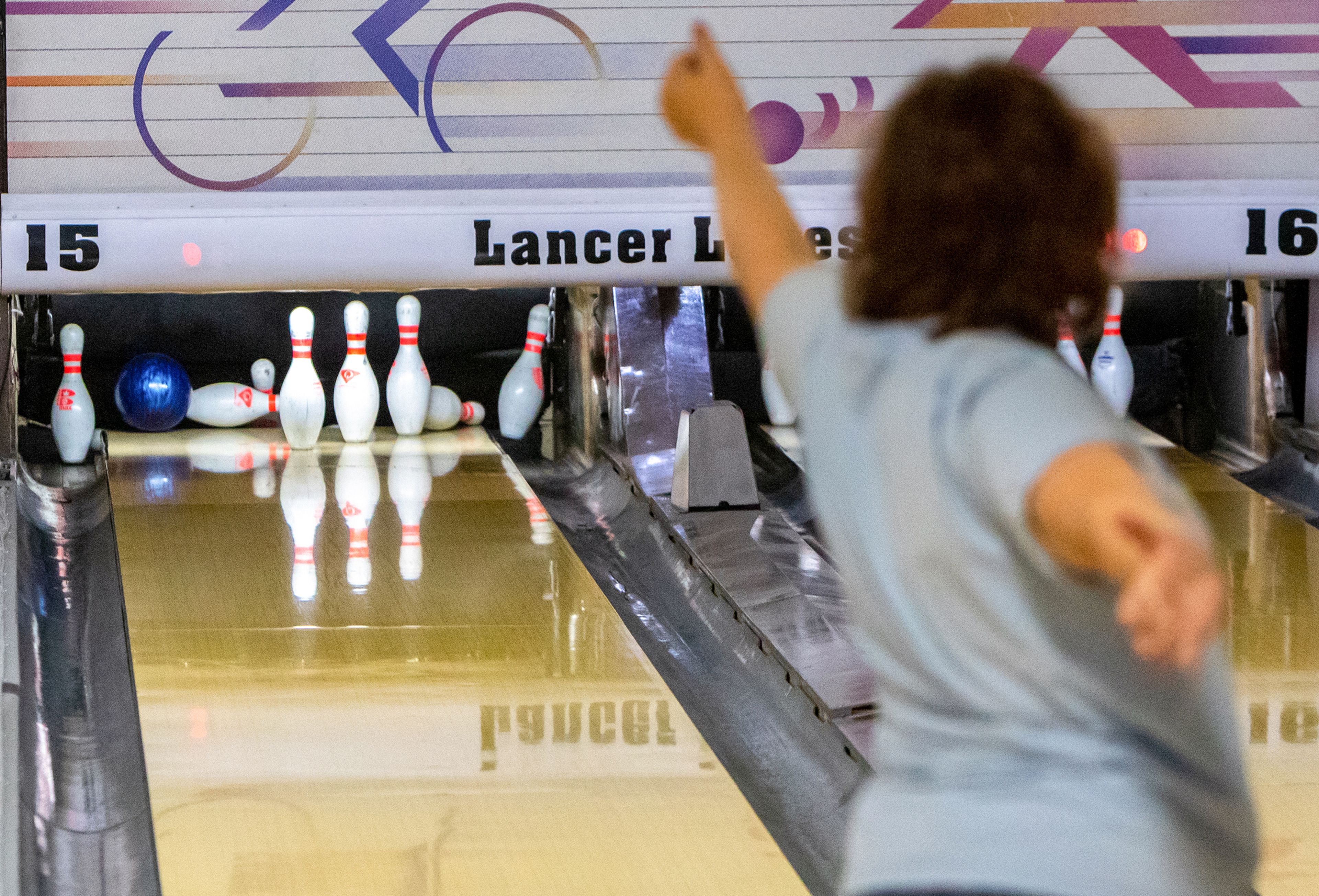 Misty Bayne celebrates her roll Saturday morning during a Twin Rivers Special Olympics of Washington team practice at Lancer Lanes in Clarkston. Misty rolled a 97 point game during this practice.