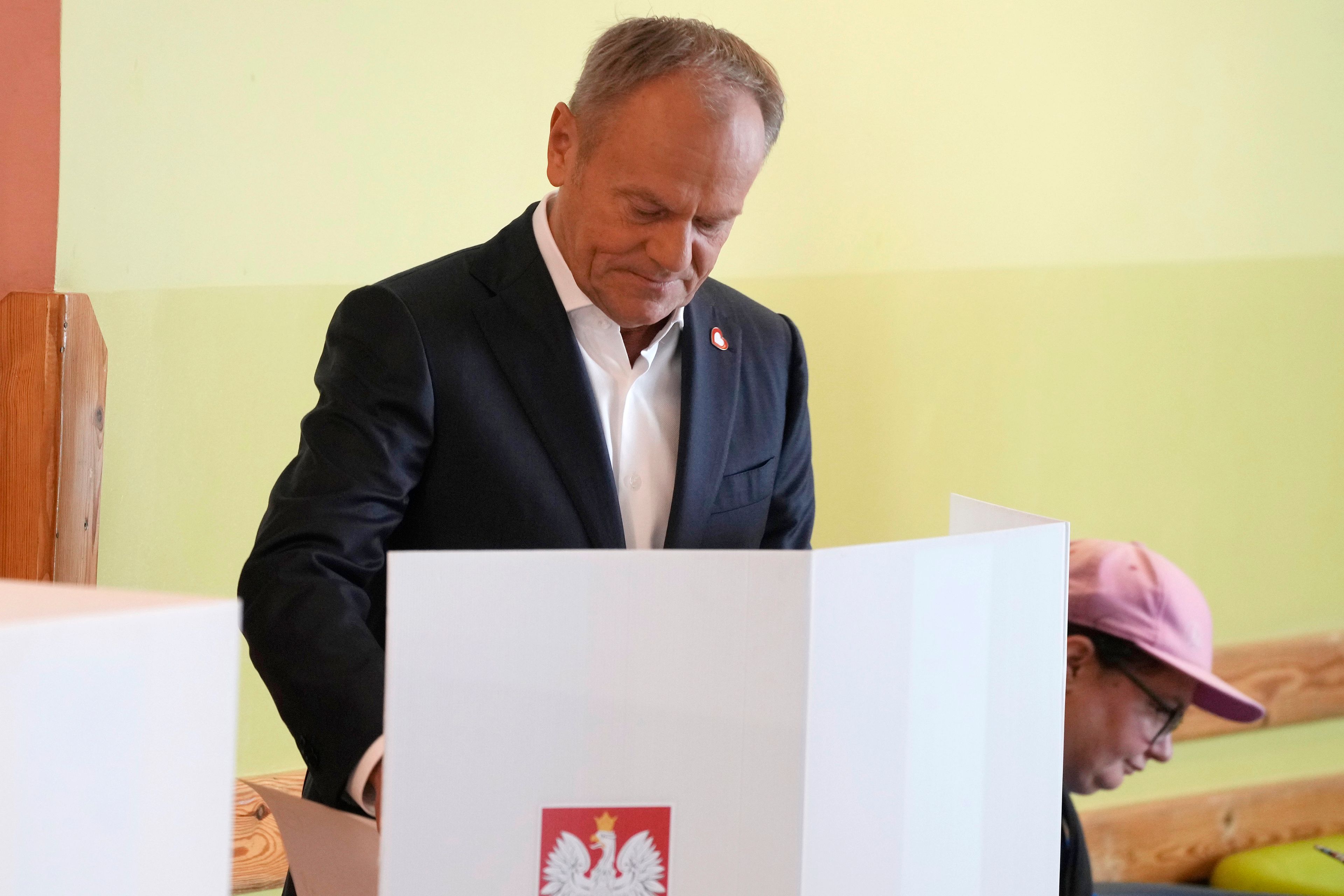 Polish Prime Minister Donald Tusk, who leads a centrist, pro-EU party, votes in the election for the European Parliament, in Warsaw, Poland, on Sunday, June 9, 2024. Polling stations have opened across Europe as voters from 20 countries cast ballots in elections that are expected to shift the European Union’s parliament to the right and could reshape the future direction of the world’s biggest trading bloc.