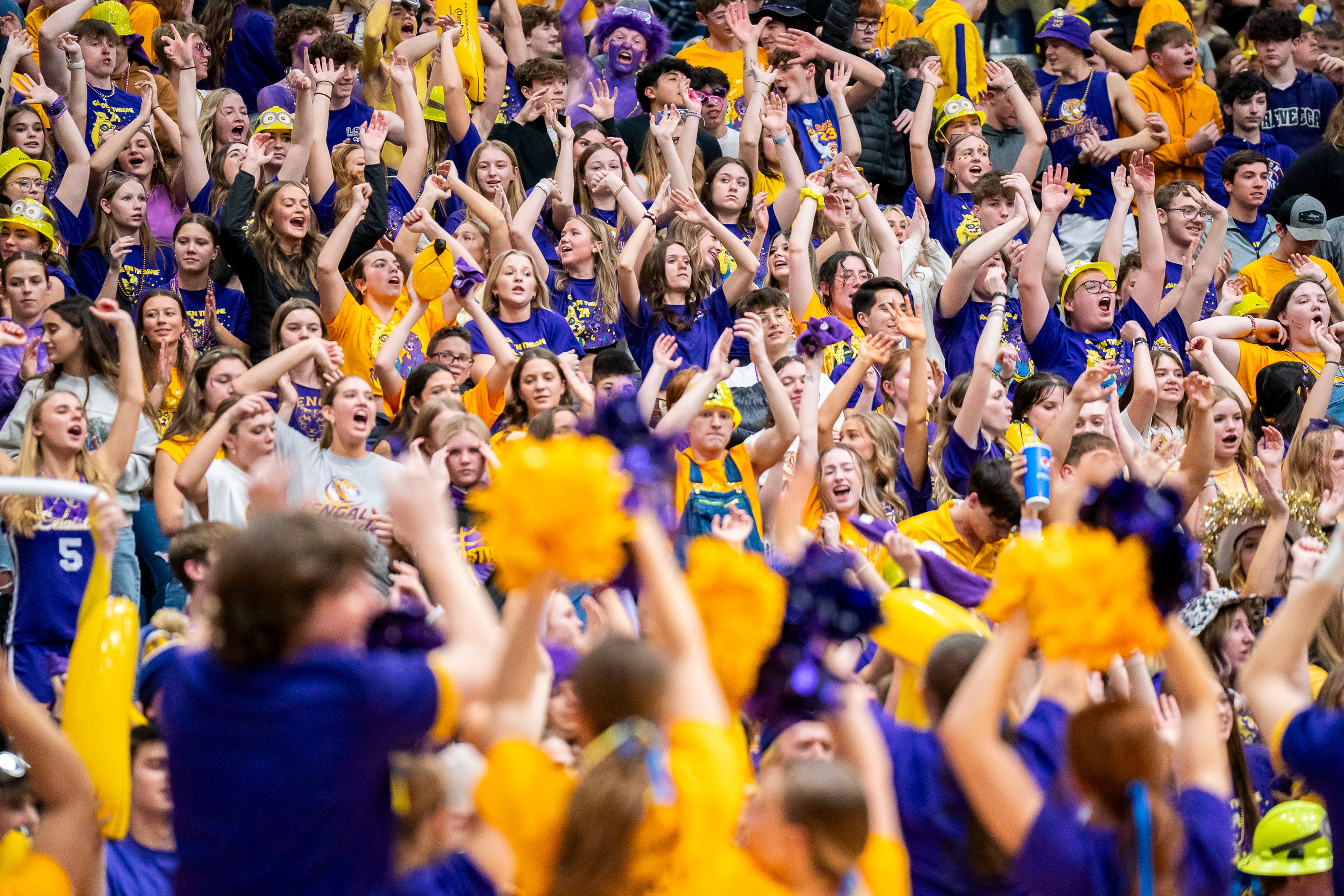 The Lewiston High School student section cheers for the men’s basketball team during their Golden Throne rivalry game against Clarkston on Friday inside the P1FCU Activity Center in Lewiston.