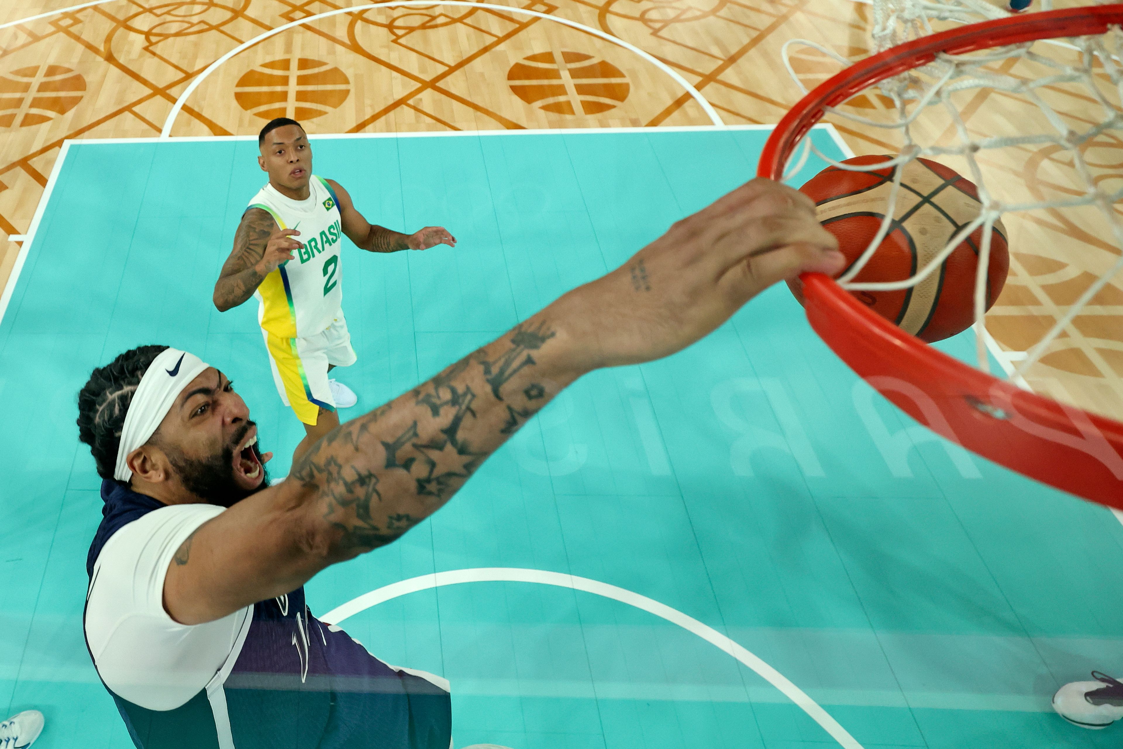 United States' Anthony Davis scores a basket during a men's quarterfinal game against Brazil at Bercy Arena at the 2024 Summer Olympics, Tuesday, Aug. 6, 2024, in Paris, France. (Jamie Squire/Pool Photo via AP)