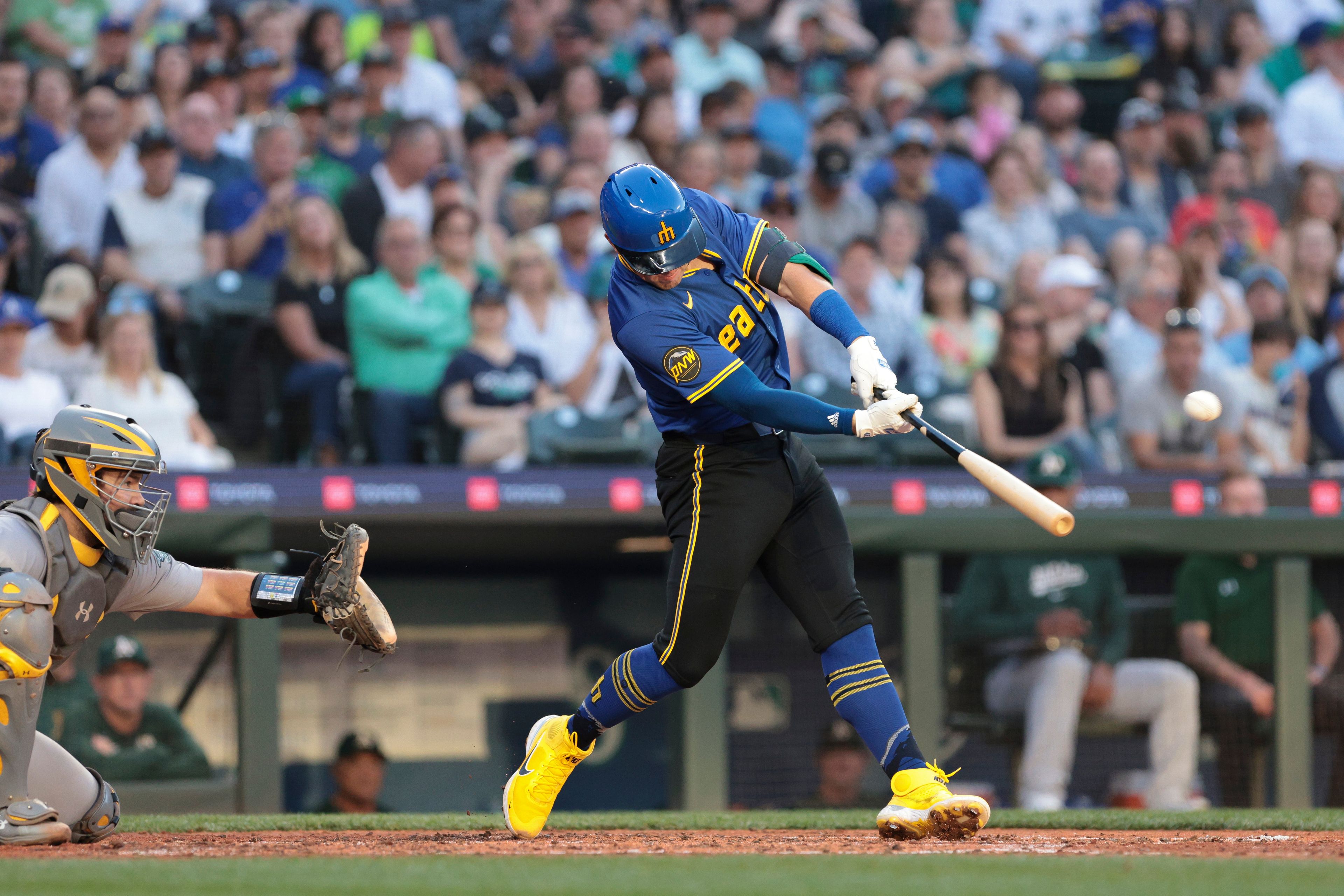 The Mariners' Dylan Moore hits a home run against the Athletics during a game Friday in Seattle.