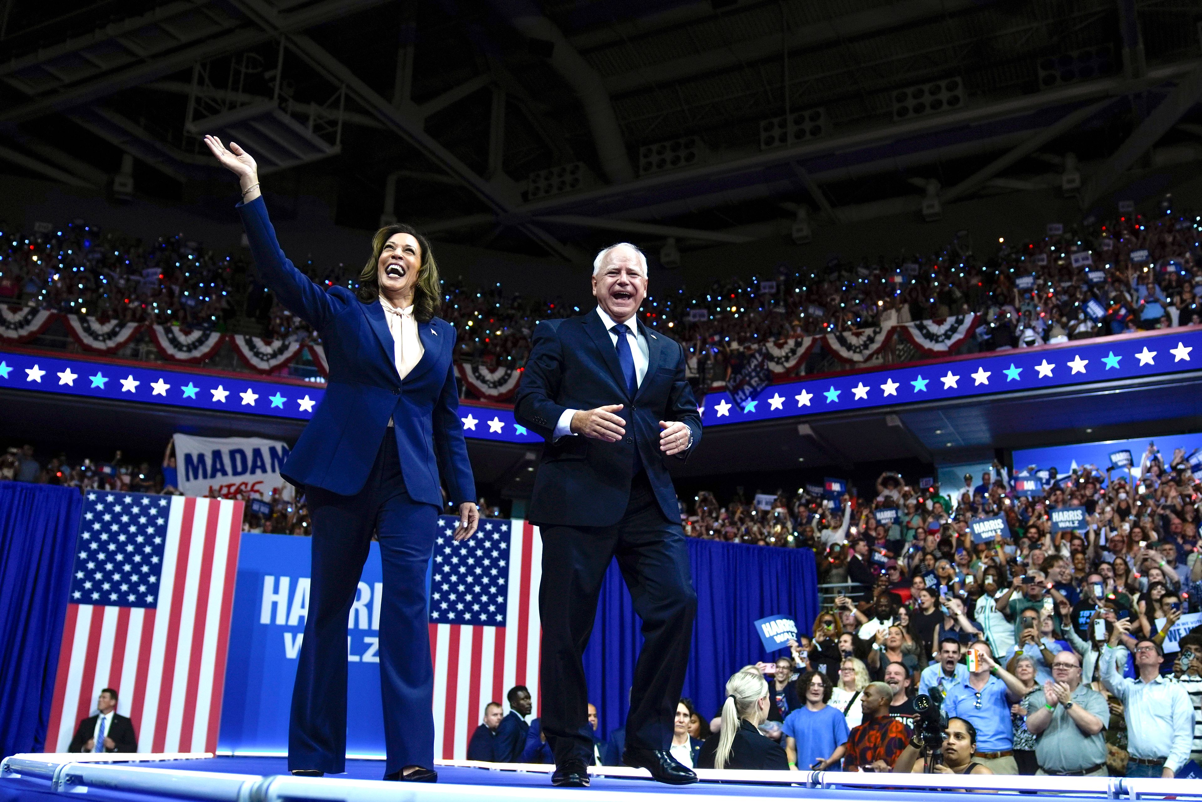 FILE - Democratic presidential nominee Vice President Kamala Harris and her running mate Minnesota Gov. Tim Walz arrive at a campaign rally in Philadelphia, Aug. 6, 2024. (AP Photo/Matt Rourke)