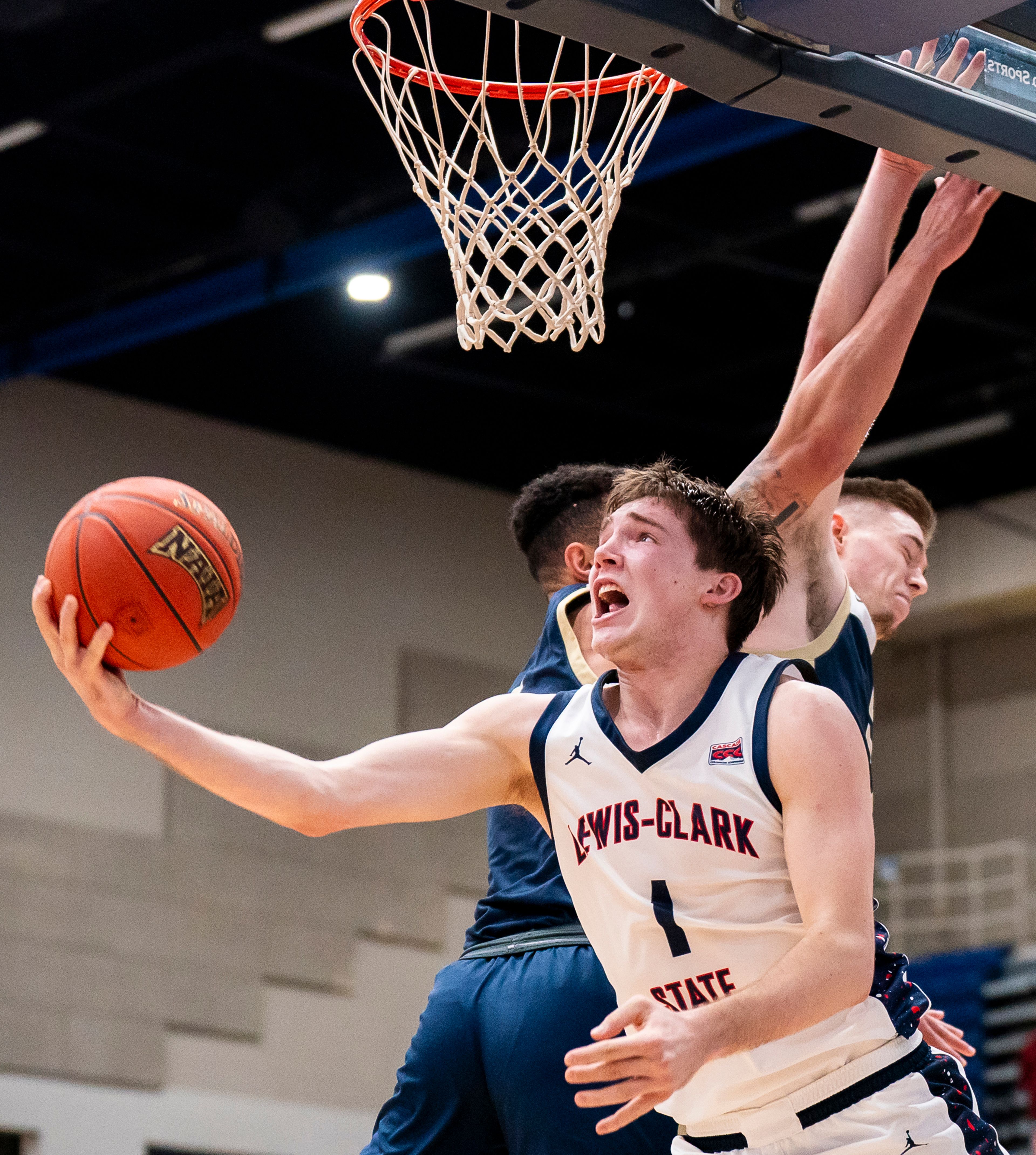 Lewis-Clark State's John Lustig goes in for a layup during a Cascade Conference quarterfinal game against Eastern Oregon on Feb. 28 at the P1FCU Activity Center in Lewiston.