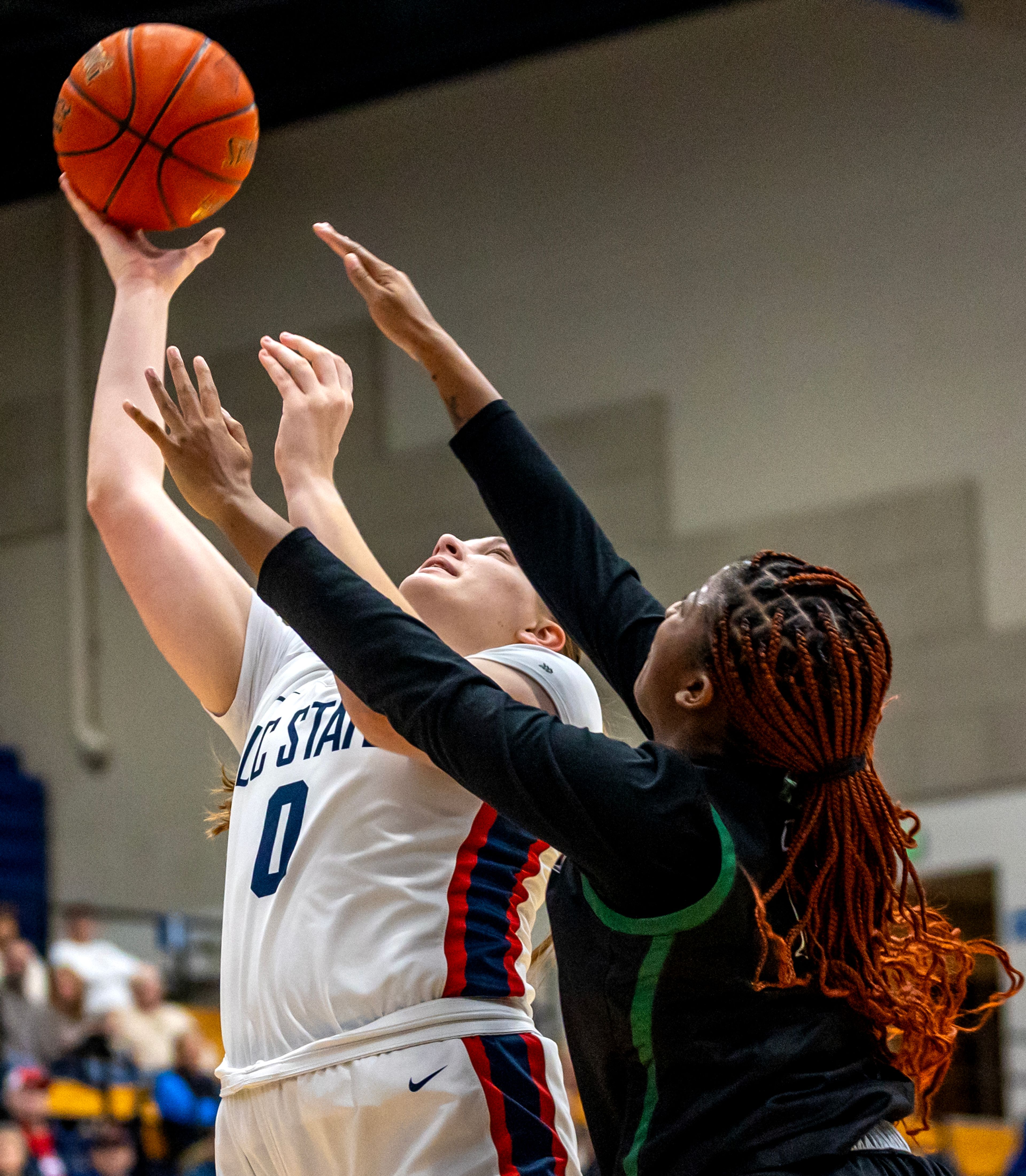 Lewis-Clark State forward Lindsey Wilson goes up for layup as Walla Walla forward Jordan Green-Wallace guards her during a quarter of a Cascade Conference game Tuesday at Lewis-Clark State College in Lewiston.