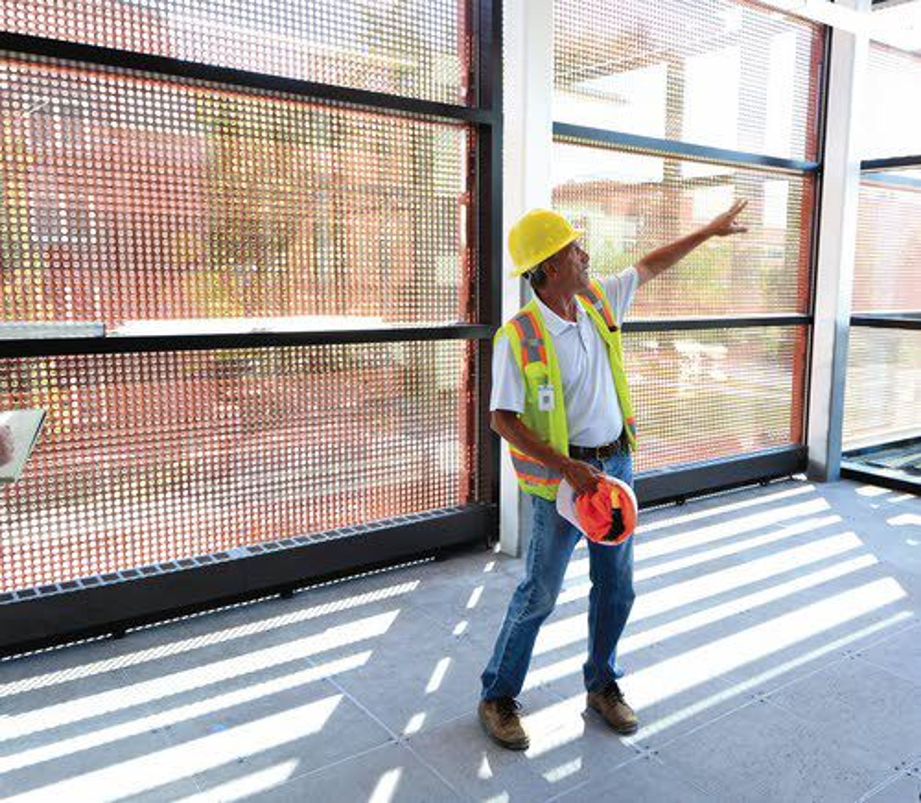 Screens on the south side of the University of Idaho’s Integrated Research and Innovation Center let in light and help in the cooling of the building. The design shades the interior when the sun hits the west side of the building.