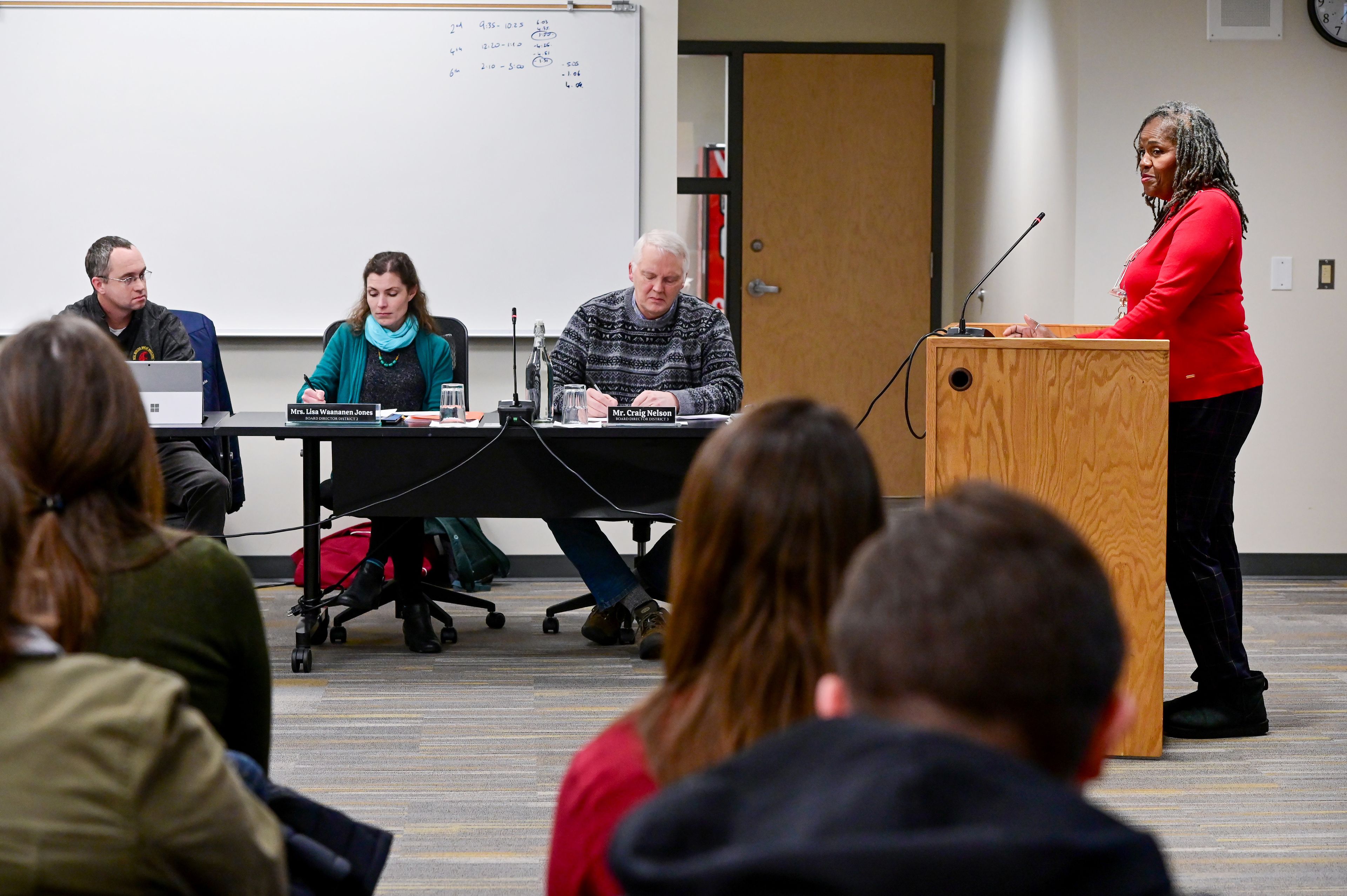 Donna Moore, right, a paraeducator at Sunnyside Elementary School, speaks during public comment at a Pullman Public Schools board meeting on Wednesday.