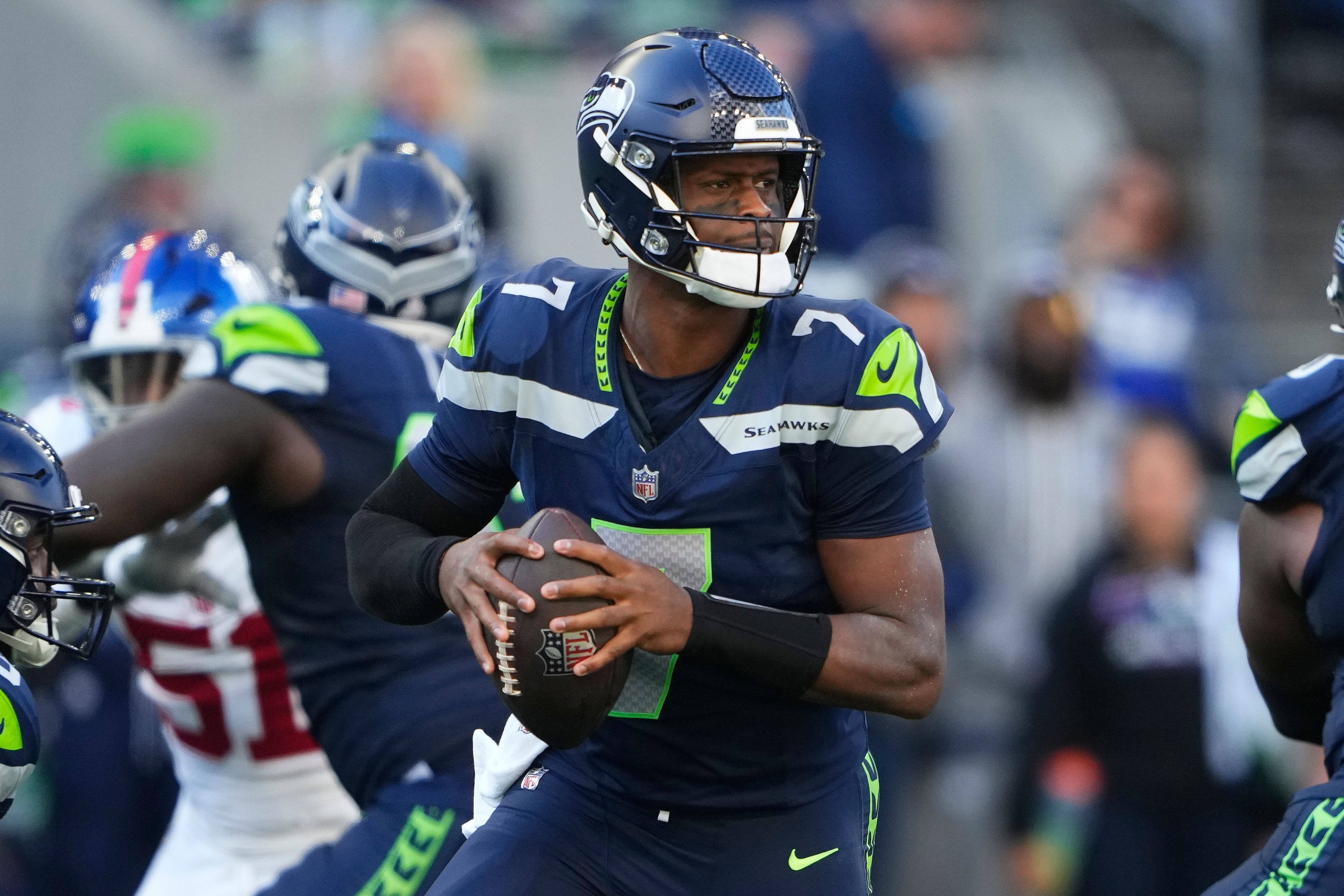 Seattle Seahawks quarterback Geno Smith (7) looks to pass during the second half of an NFL football game against the New York Giants, Sunday, Oct. 6, 2024, in Seattle. (AP Photo/Lindsey Wasson)