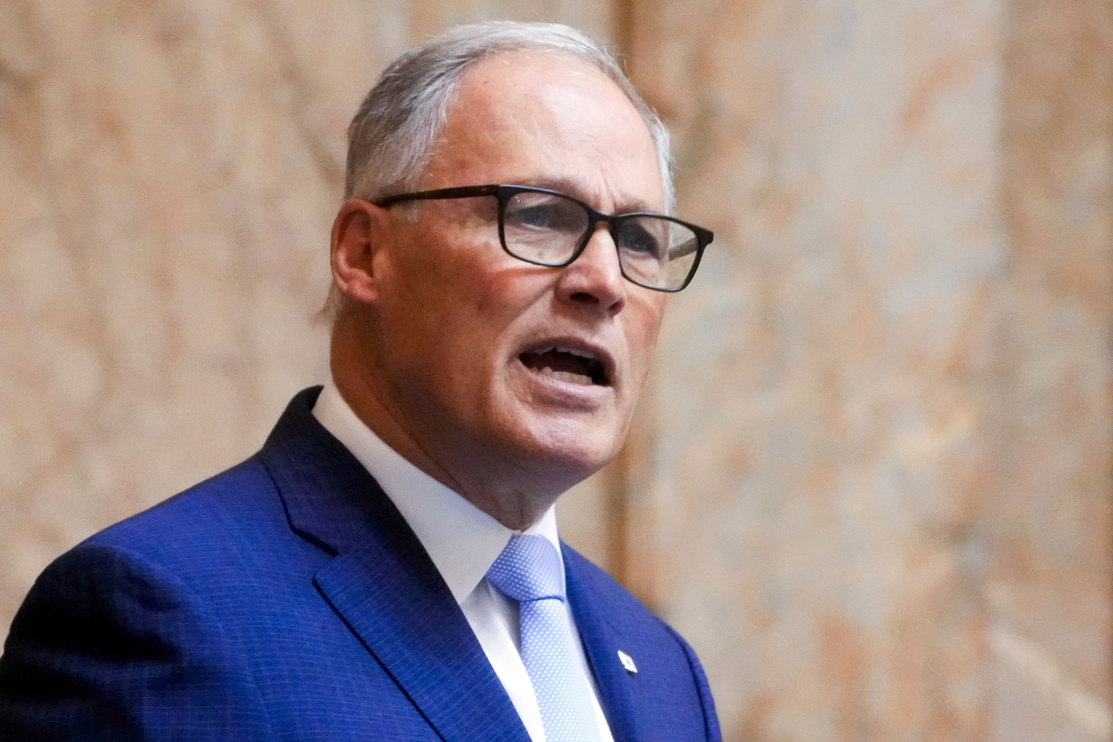 FILE - Washington Gov. Jay Inslee delivers his annual State of the State address to a joint legislative session in House chambers at the Washington state Capitol, Jan. 9, 2024, in Olympia, Wash. Inslee on Thursday, May 23, rejected a recommendation to cut a proposal for what would be the state's largest wind farm in half, giving new life to the $1.7 billion project. (AP Photo/Lindsey Wasson, File)