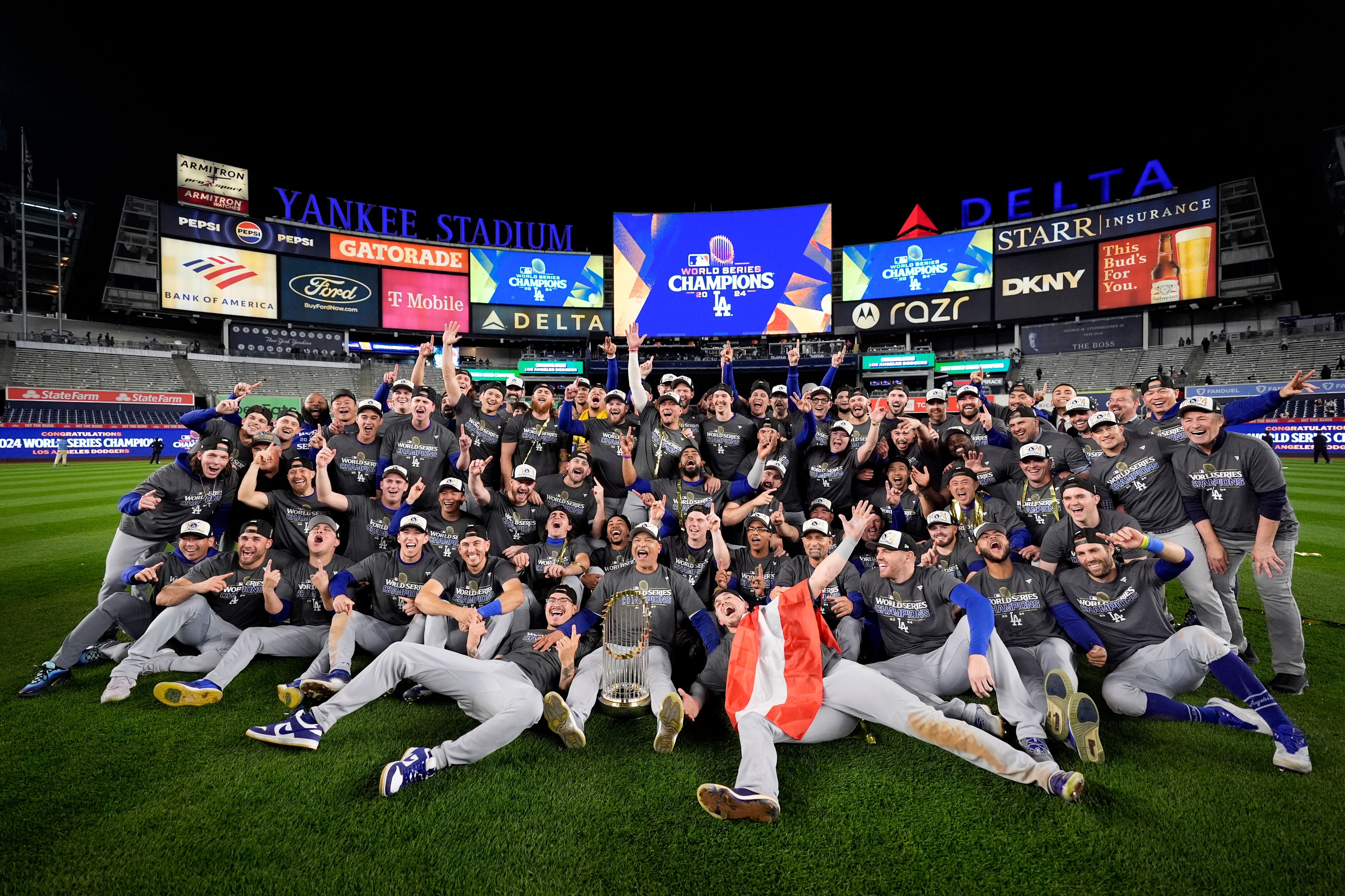 The Los Angeles Dodgers pose for a team picture after their win against the New York Yankees in Game 5 to win the baseball World Series, Thursday, Oct. 31, 2024, in New York. (AP Photo/Ashley Landis)