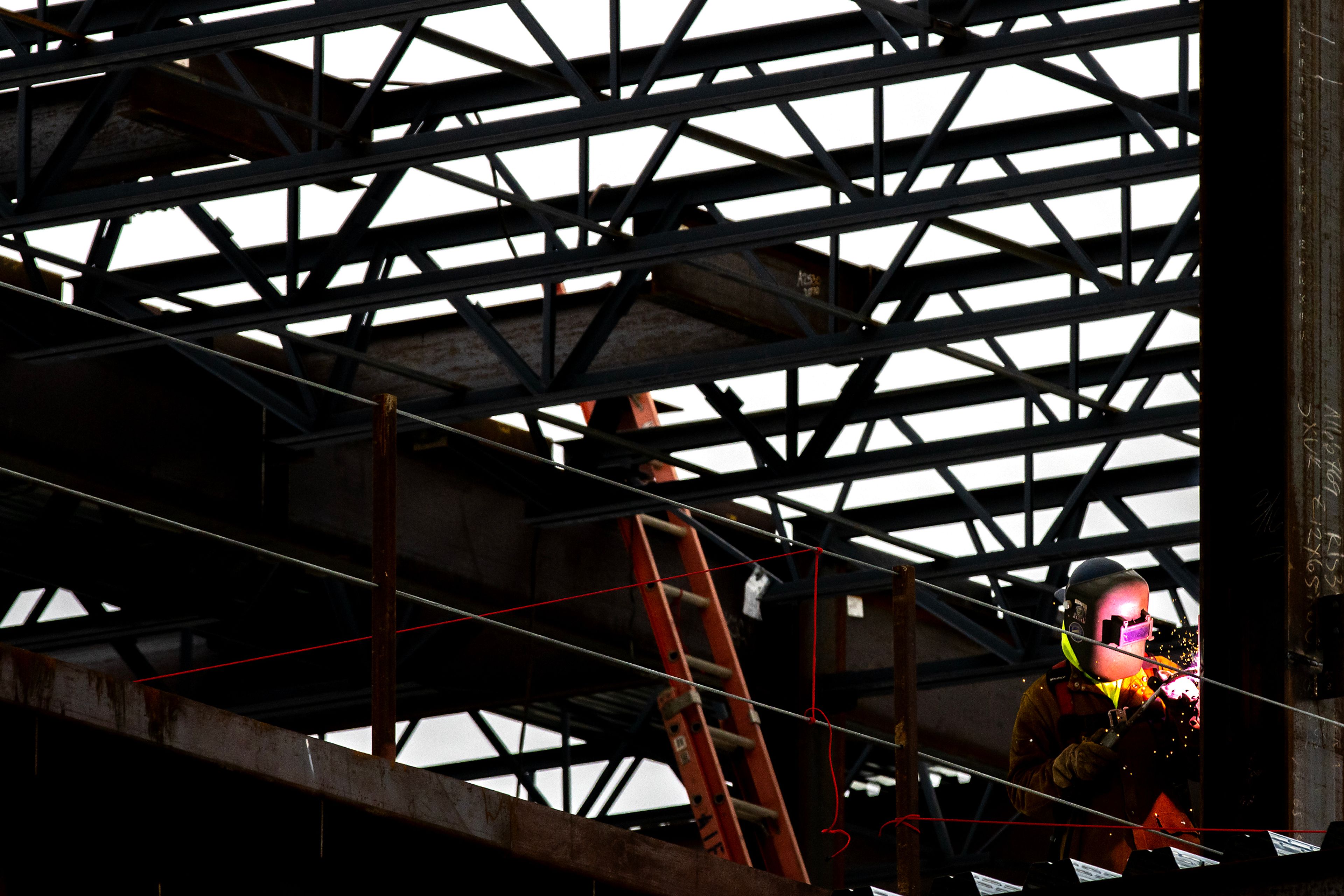 A worker welds at the new courthouse Tuesday in Lewiston.