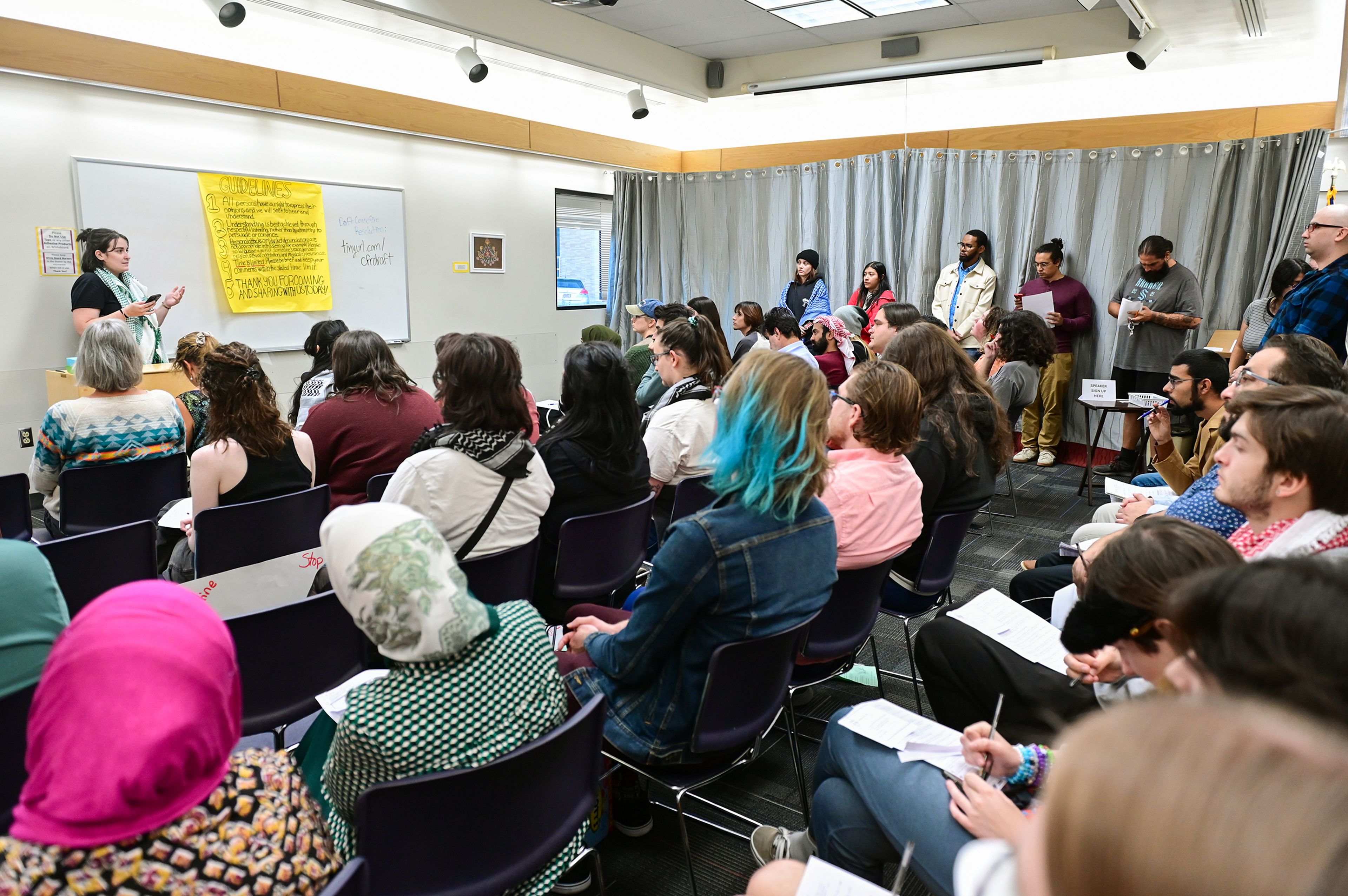 Leda Zakarison, left, shares her backstory and gives input on a drafted ceasefire resolution for Gaza and Israel at a listening session for the draft Monday at the Neill Public Library in Pullman.