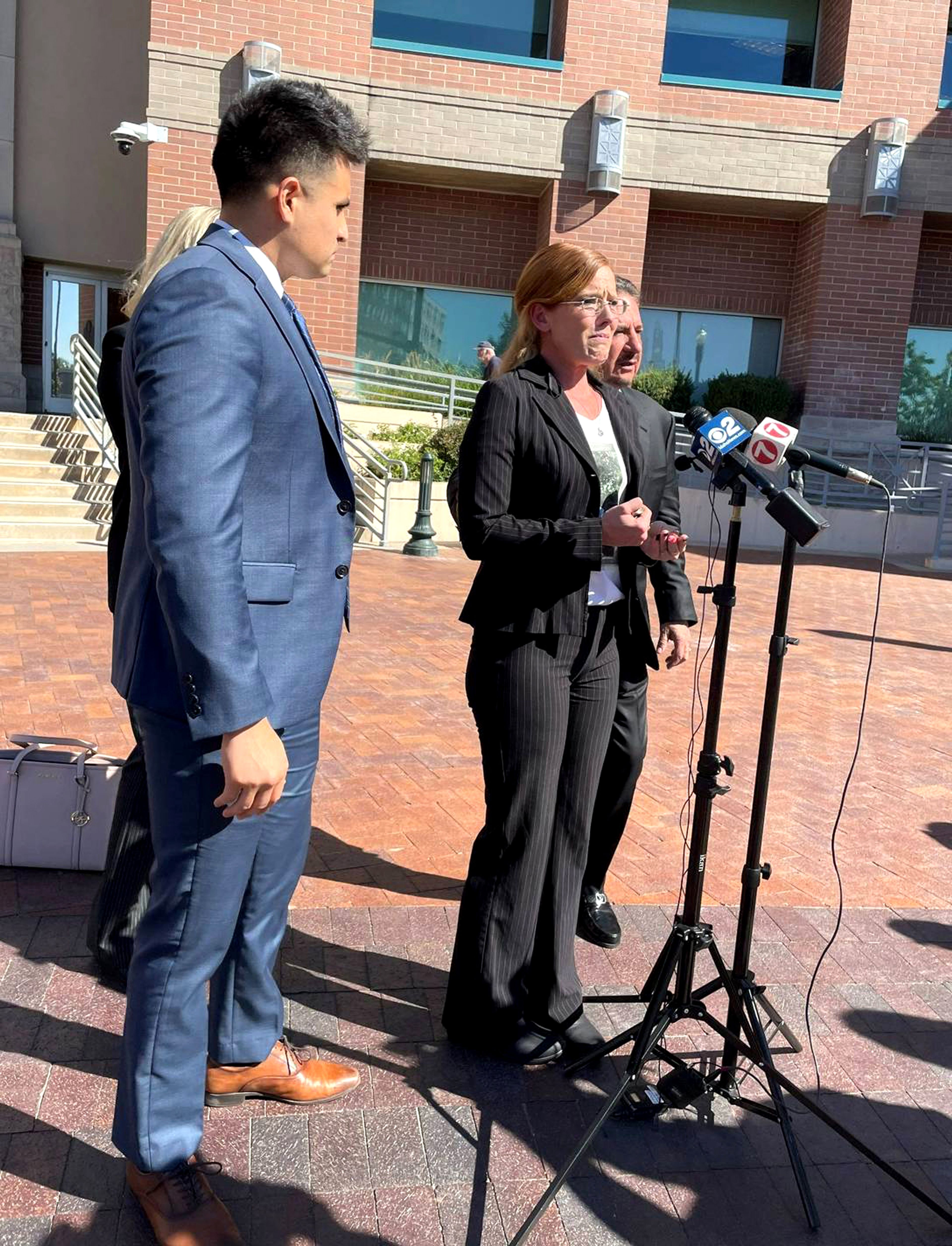 Melissa Walton, of Clarkston, appears with her lawyers at a news conference in Boise earlier this week. Walton and her lawyers announced they had filed a lawsuit against the Boise Police Department for the shooting death of her son, Zachary Snow.