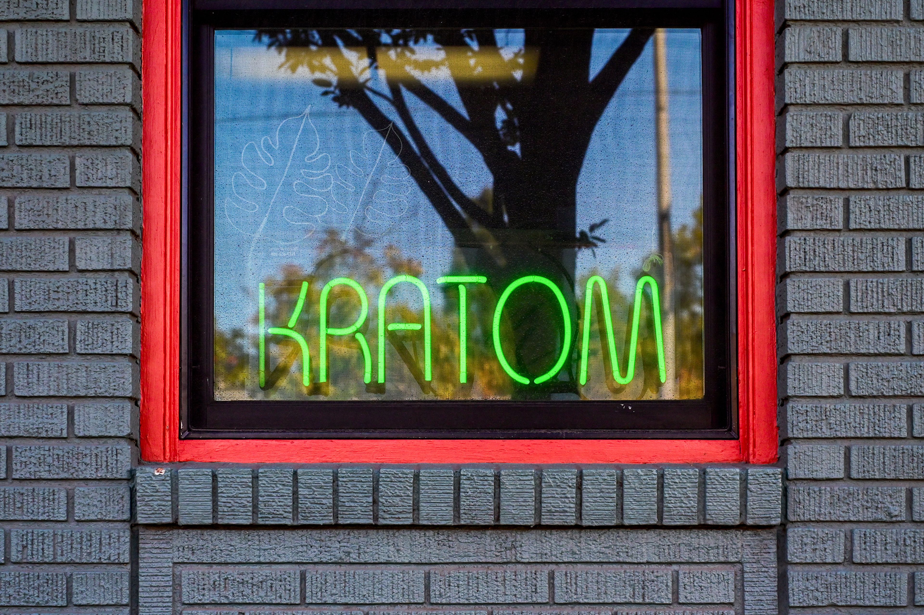 A neon sign sits in the window of Kratom Kings on Friday in Moscow.