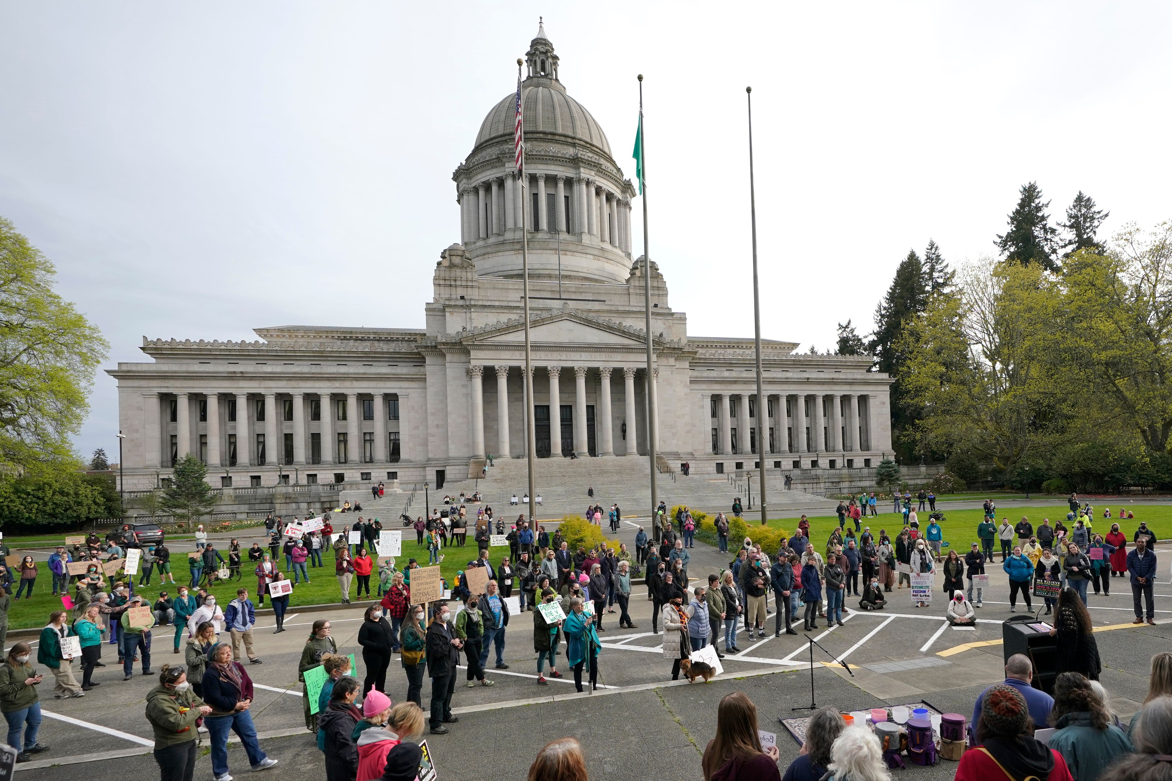 People demonstrating in favor of abortion rights gather during an evening rally, Tuesday, May 3, 2022, at the Capitol in Olympia, Wash. (AP Photo/Ted S. Warren)