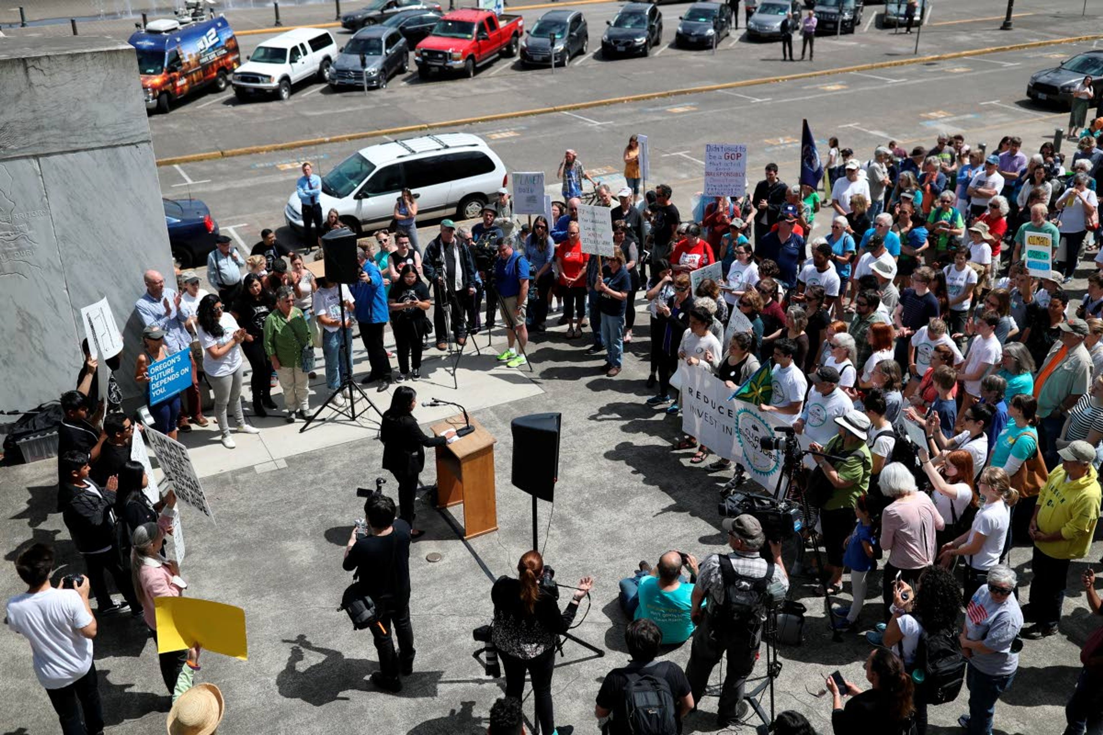 Demonstrators gather at the Oregon Capitol Building in support of the climate change bill HB2020 on Tuesday, June 25, 2019. (Noble Guyon/The Oregonian via AP)