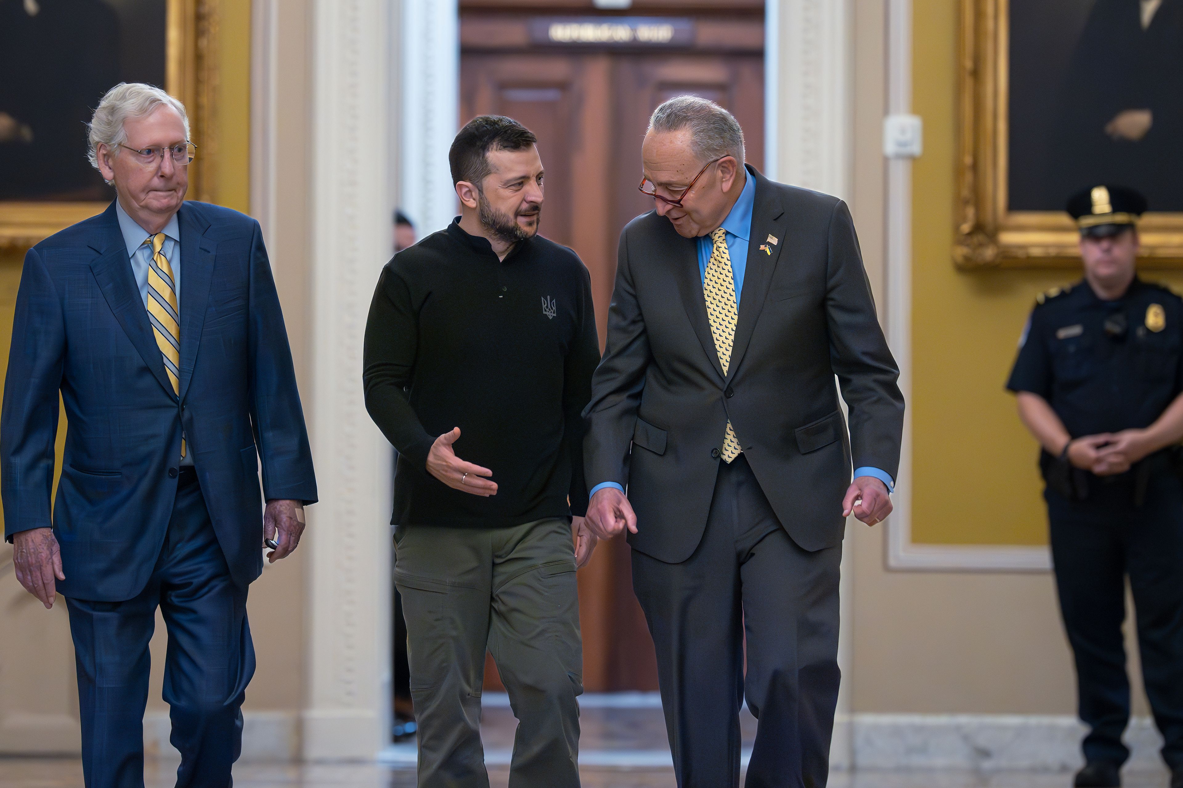 Ukrainian President Volodymyr Zelenskyy, center, walks with Senate Minority Leader Mitch McConnell, R-Ky., left, and Senate Majority Leader Chuck Schumer, D-N.Y., as he arrives for a briefing with lawmakers about the war effort against Russia, at the Capitol in Washington, Thursday, Sept. 26, 2024. (AP Photo/J. Scott Applewhite)