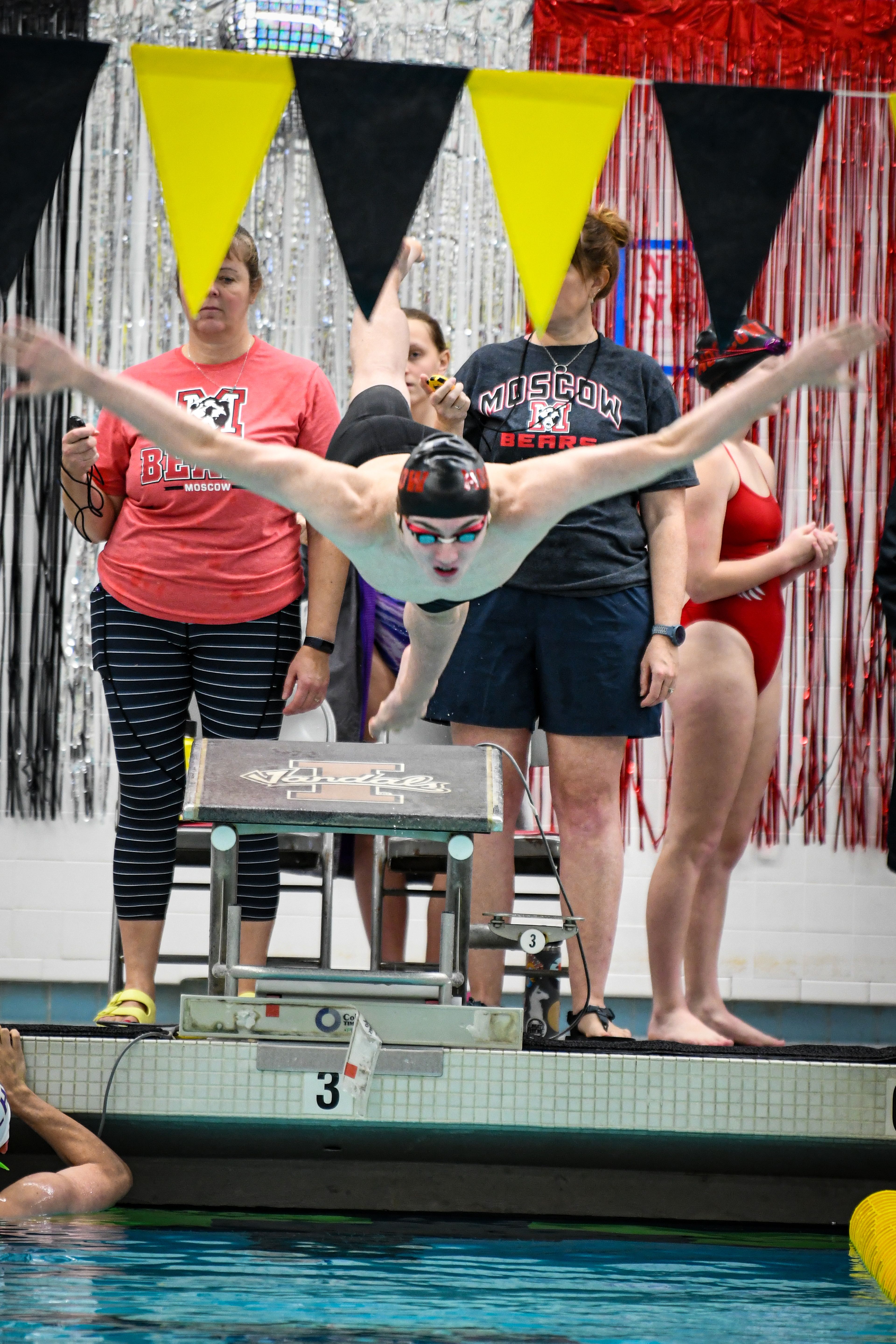 Moscow swimmer Noah Crossler leaps into the pool to start a race. Crossler recently broke an Idaho 5A state record in the 100-yard butterfly.