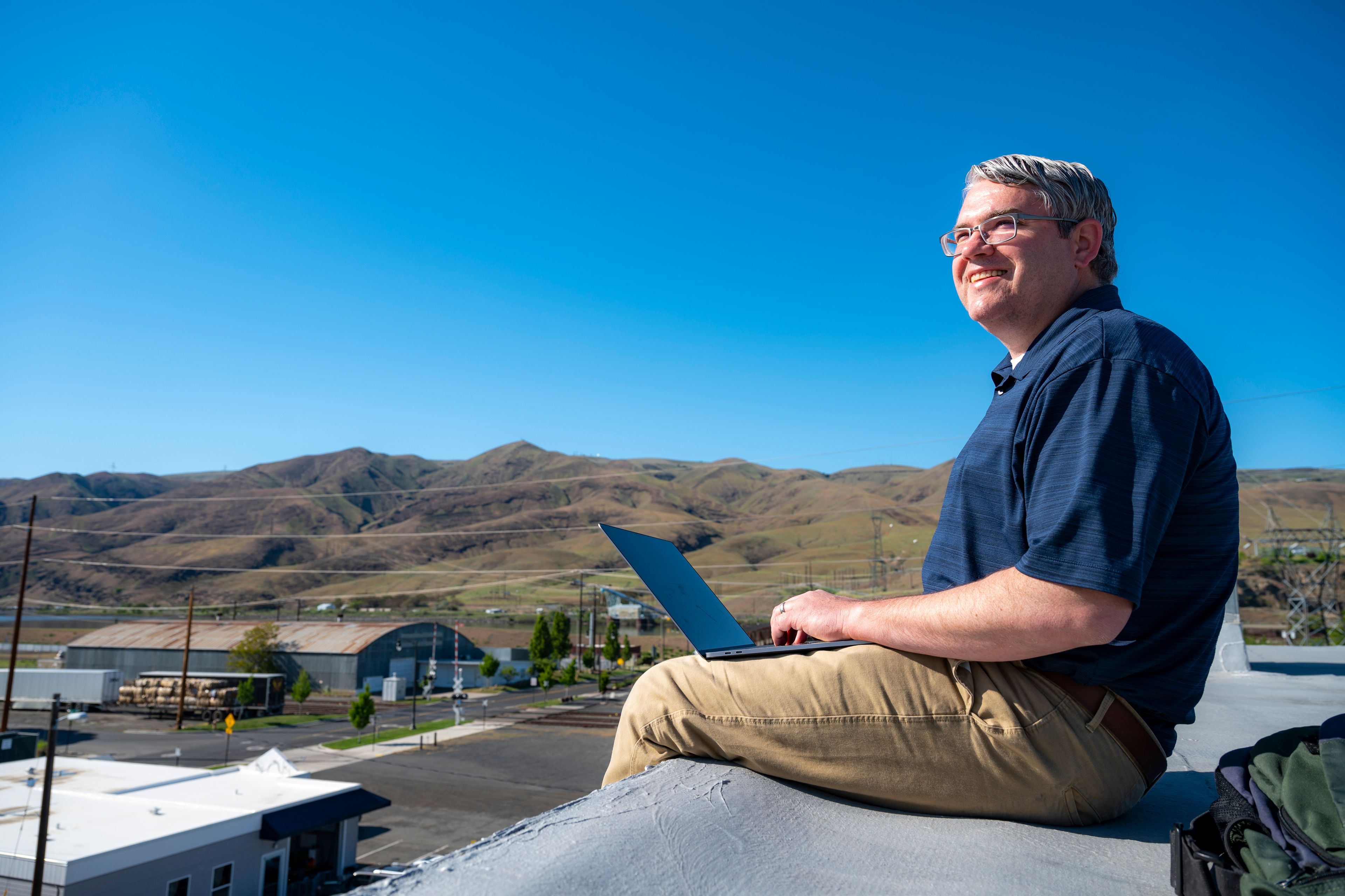 Lewiston Tribune Managing Editor Matt Baney poses for a portrait on the roof of the Tribune.