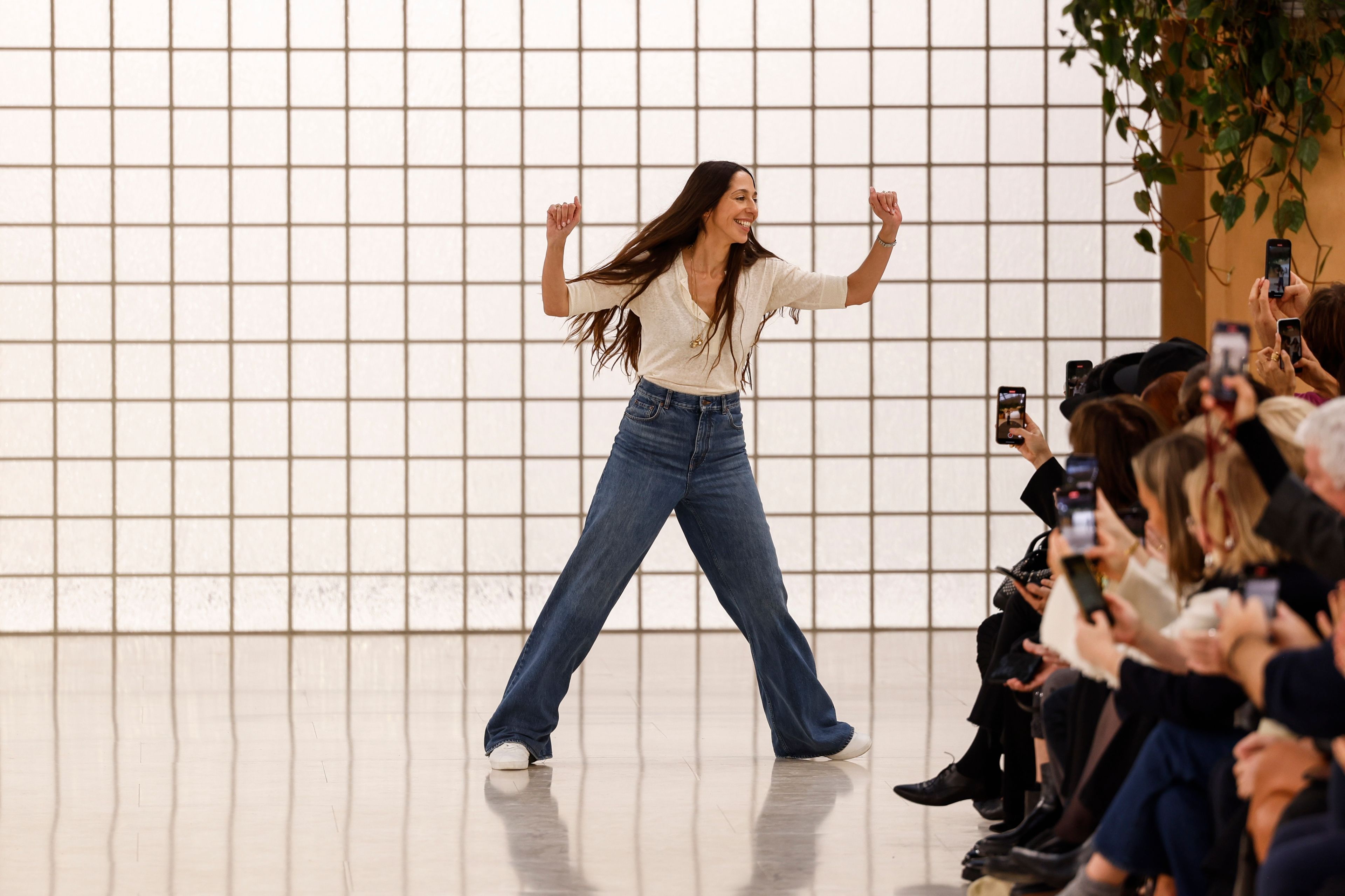 Designer Chemena Kamali accepts applause after the Chloe Spring/Summer 2025 collection presented Thursday, Sept. 26, 2024, in Paris. (Photo by Vianney Le Caer/Invision/AP)