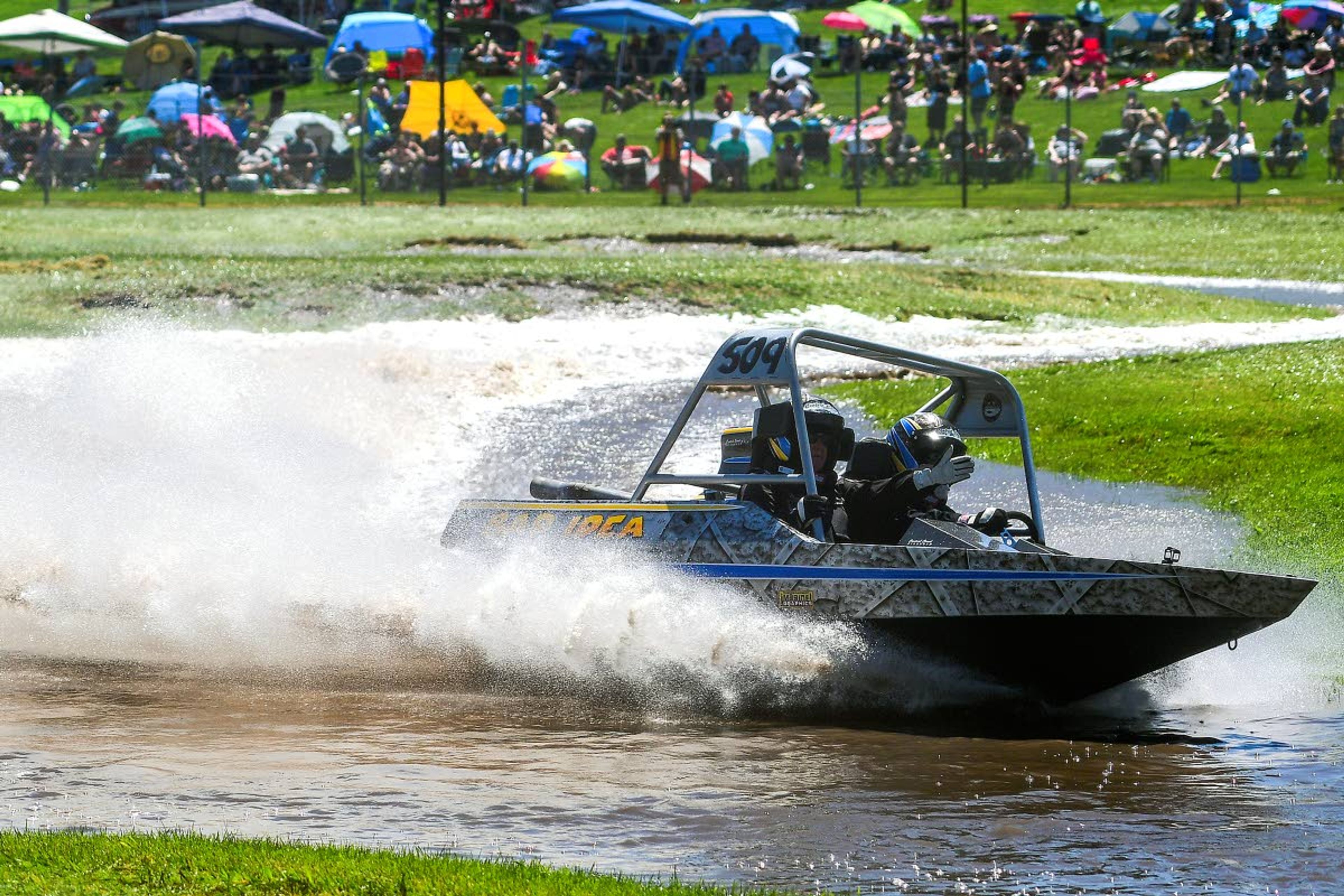 Bad Idea, driven by Eric Petring, of Clarkston, and navigated by Karen Mesa, of Portland, whisks around a corner during a Modified Class qualifying heat run at the Webb's Slough sprint boat races on Saturday in St. John.