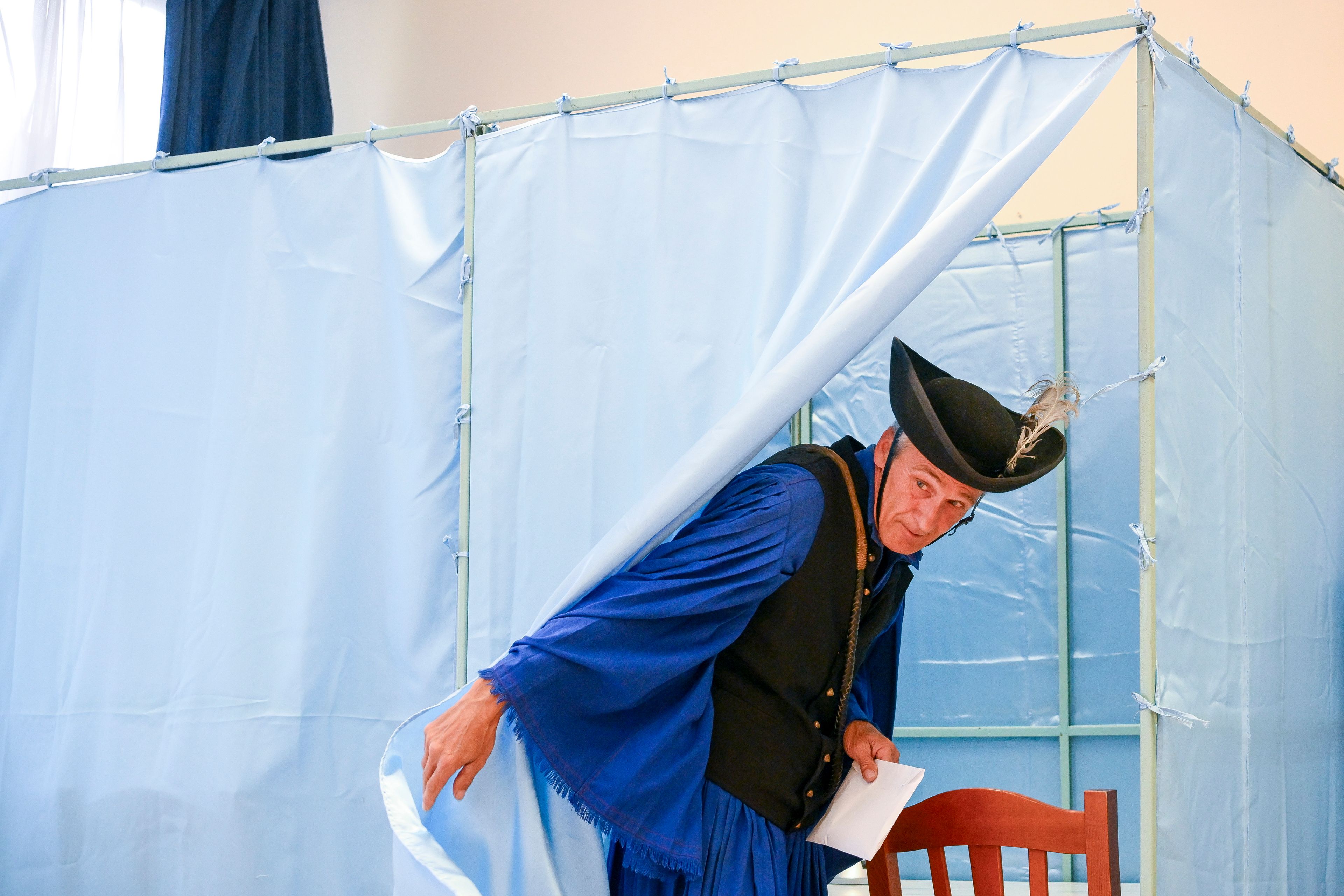 Traditional Hungarian horse-herdsman, so-called csikos, Janos Garai, casts his vote at a polling station during the European Parliament and local elections, in Hortobagy, Hungary, Sunday, June 9, 2024. Voters across the European Union are going to the polls on the final day of voting for the European parliamentary elections to choose their representatives for the next five-year term.