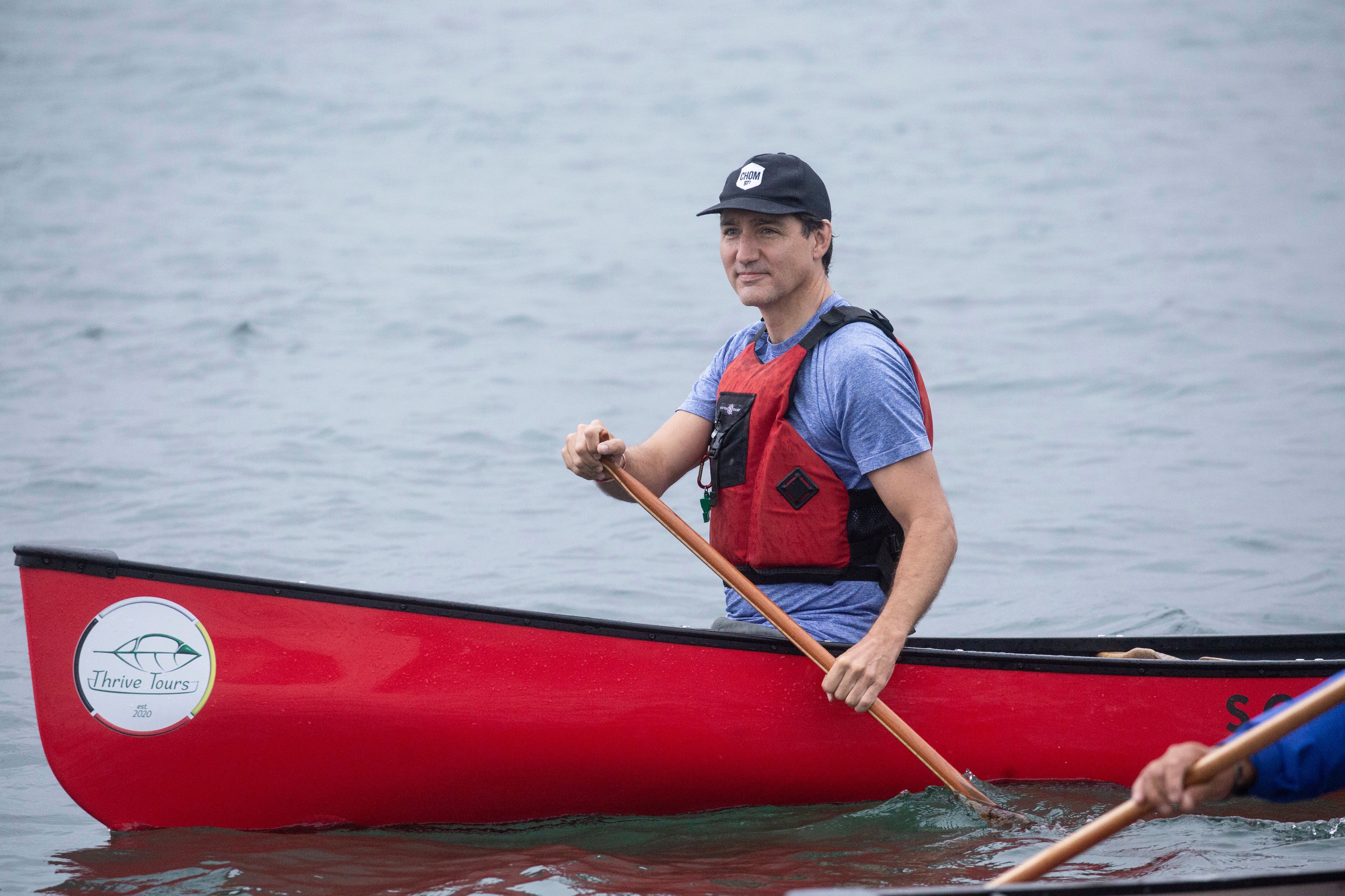 Prime Minister Justin Trudeau canoes with local Indigenous leaders on the Saint Marys River in Sault Ste.-Marie, Ont., Friday, Aug. 30, 2024.