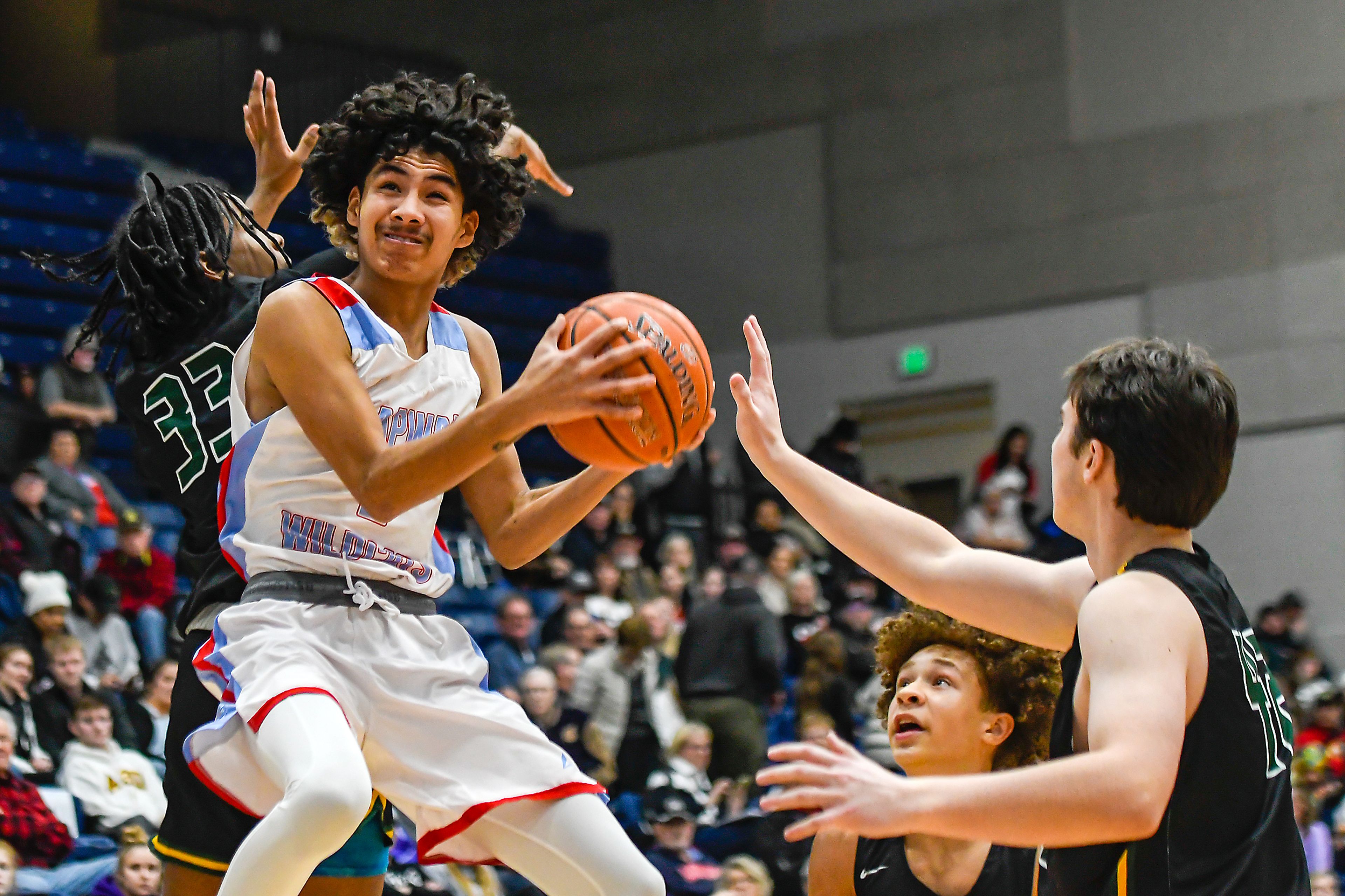 Lapwai guard Terrell Ellenwood-Jones drives through heavy traffic during Thursday’s Avista Holiday Tournament boys basketball final at the P1FCU Activity Center on the campus of Lewis-Clark State College.