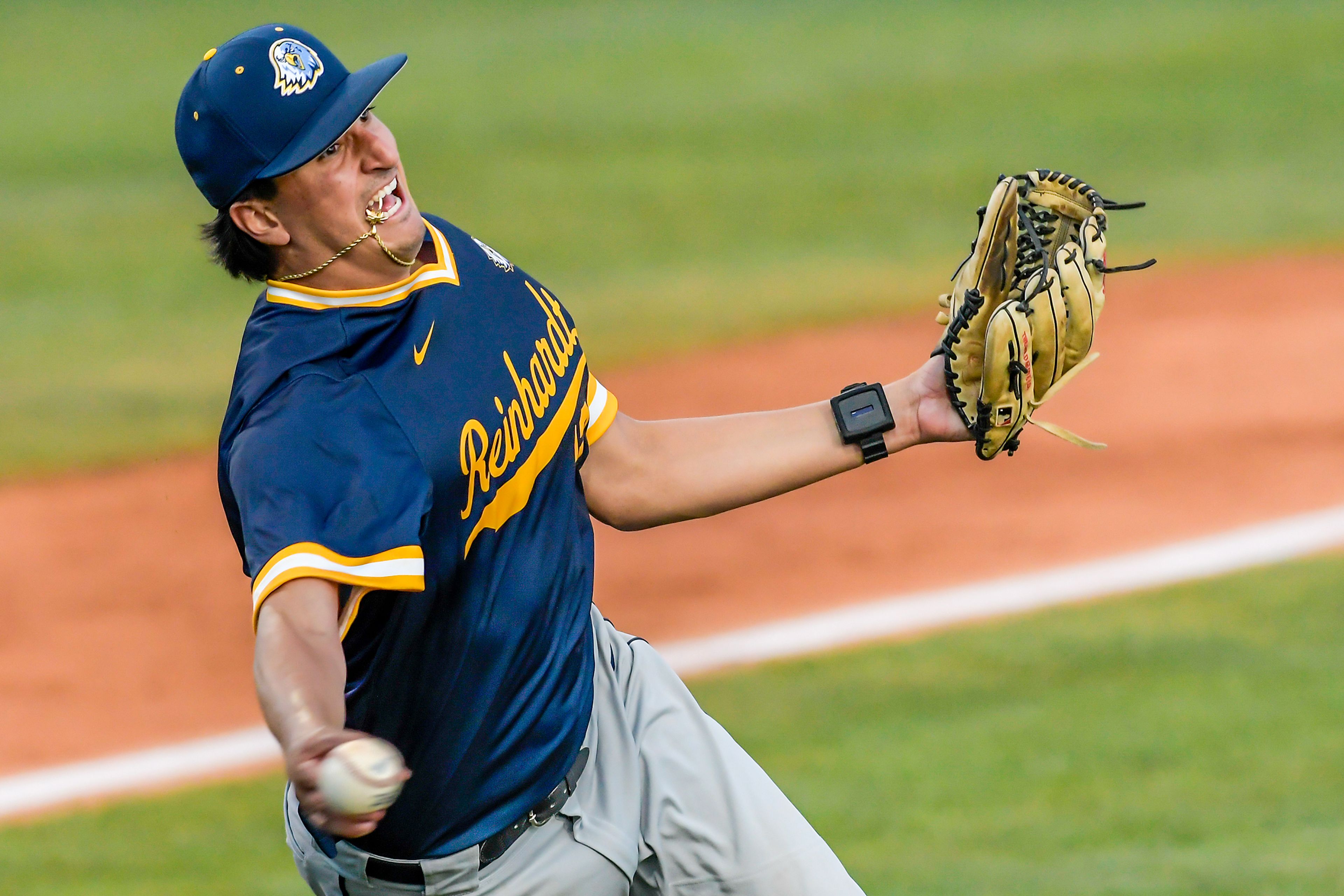 Reinhardt pitcher Andrew Herbert throws to first on a Tennessee Wesleyan bunt in Game 18 of the NAIA World Series at Harris Field Thursday in Lewiston.