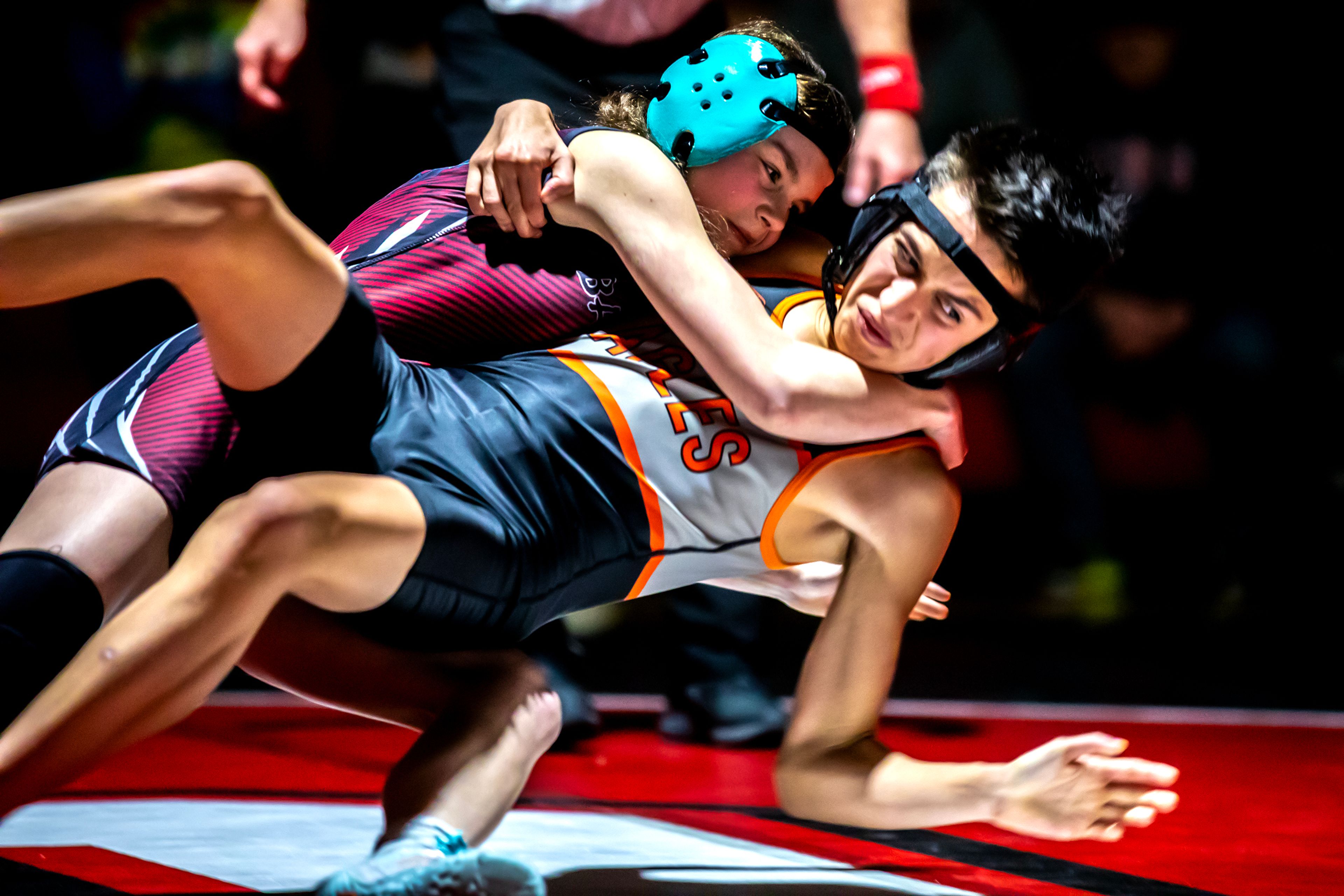 Clarkston’s Makenzie Weza throws West Valley’s Anthony Berube to the mat in the 106 pound weight class match during a wrestling duel Wednesday at Clarkston.