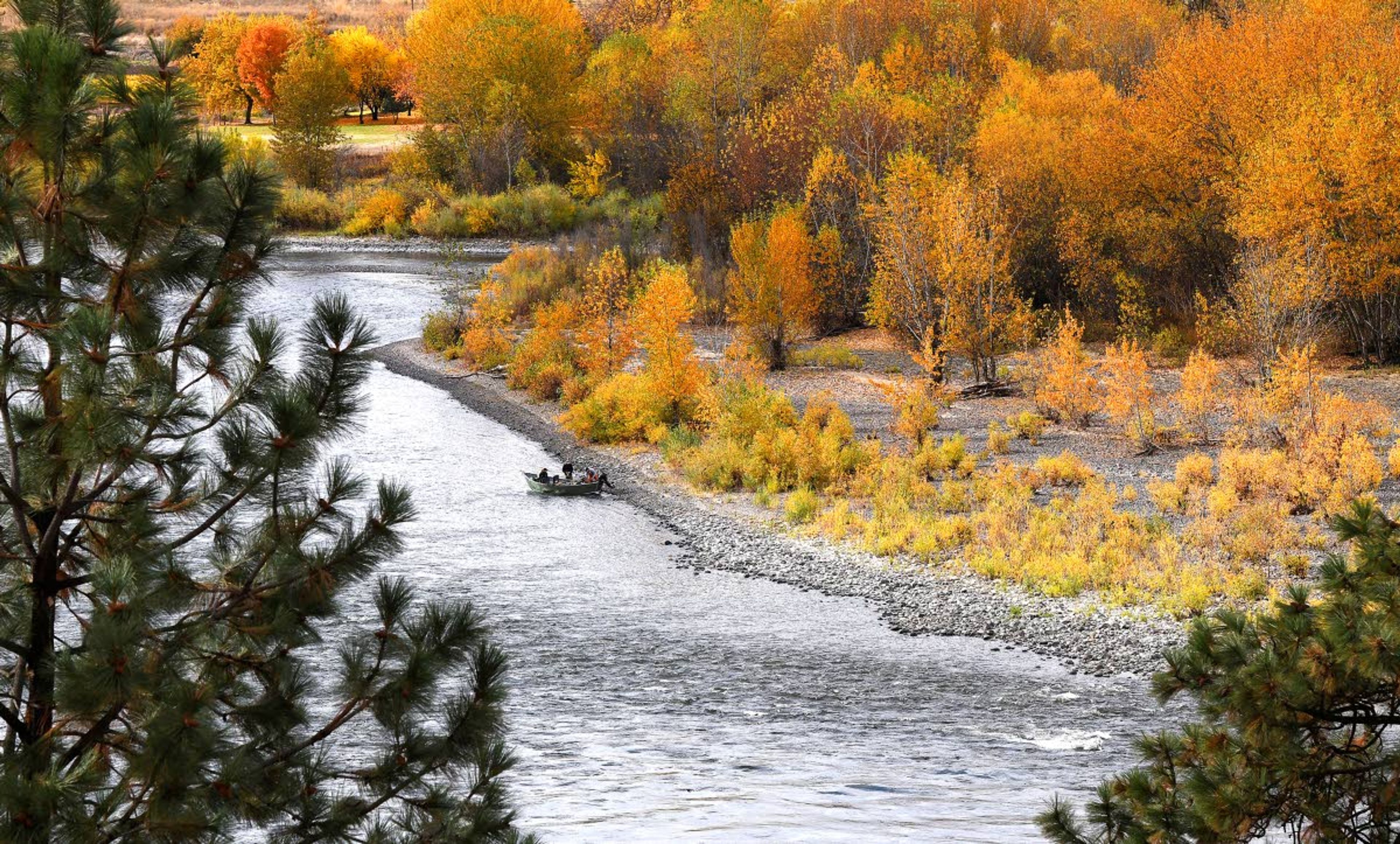 A group of fishermen shoves off after taking a break from fishing for steelhead in the Clearwater River. The federal government is processing a plan that could affect the future of steelhead fishing in Idaho.