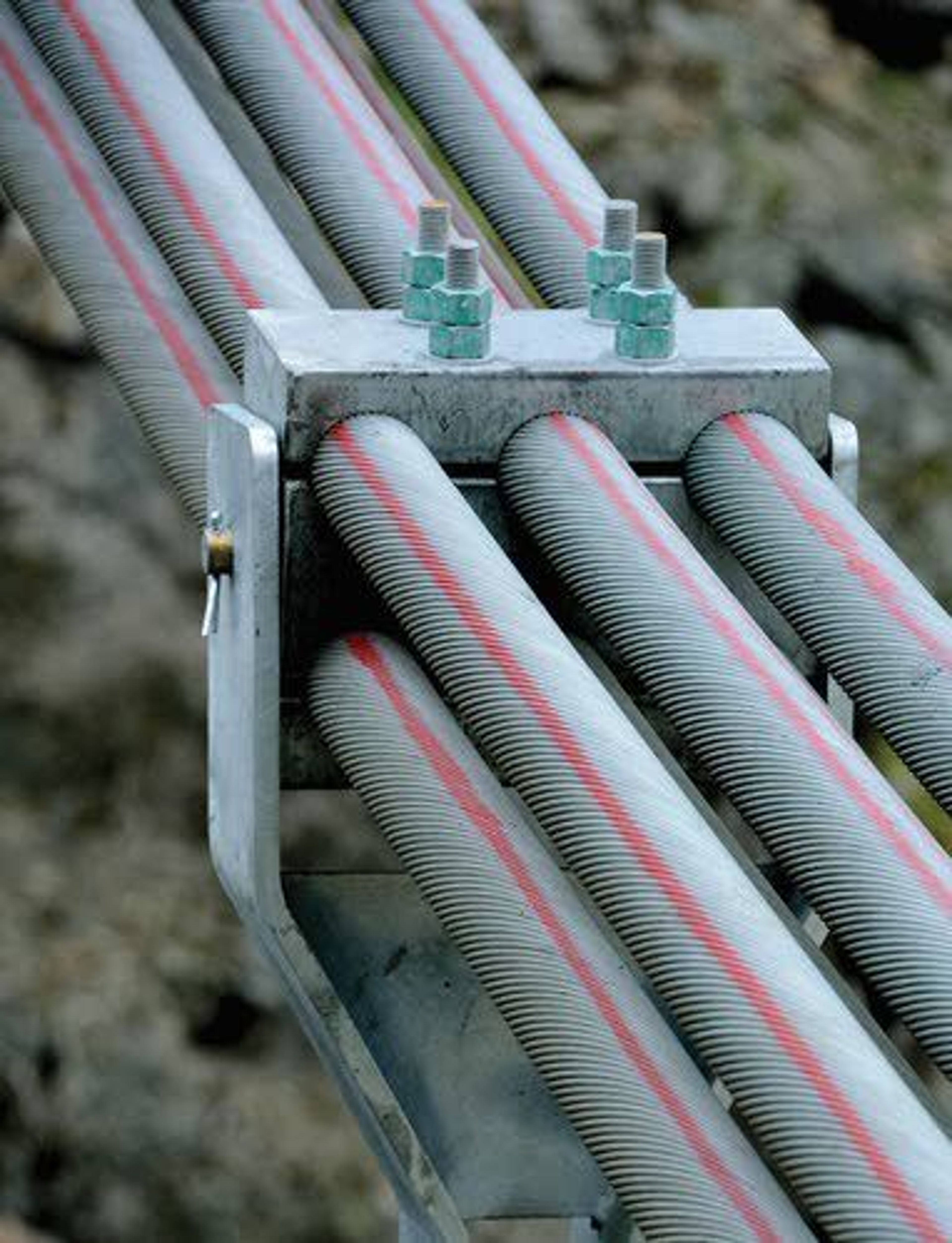 Six cables, each three inches thick, run the length of the bridge on both sides and are buried deep into the ground.