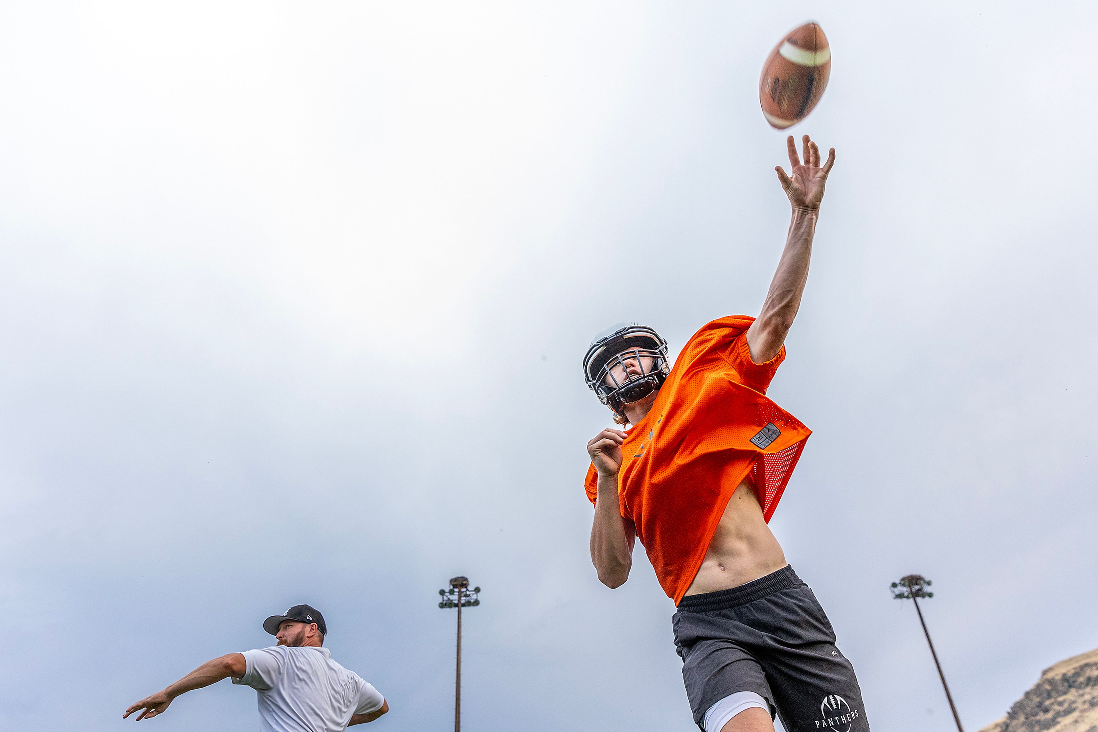 Quarterback Cody Ells throws a ball at football practice Monday in Asotin.