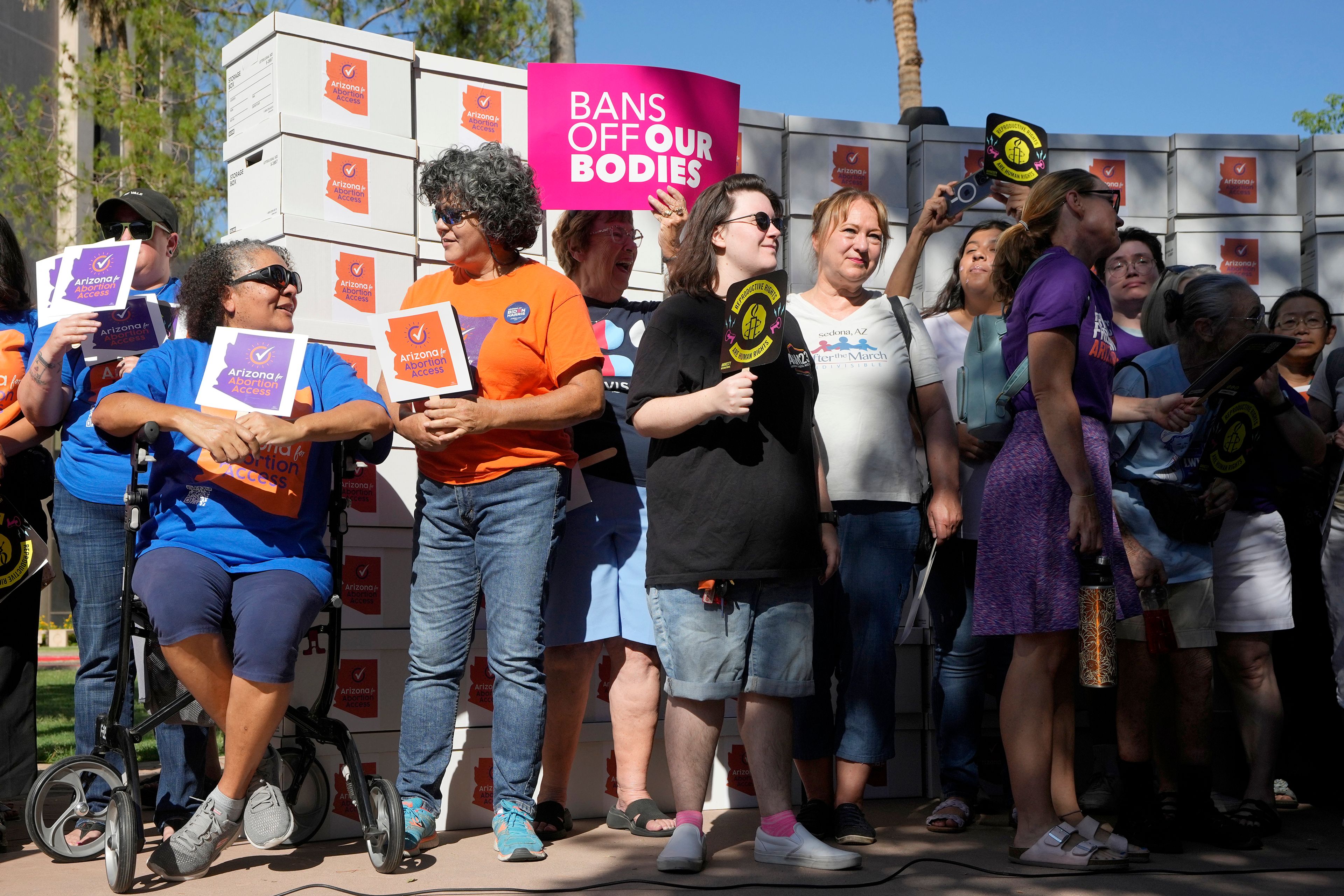 FILE - Arizona abortion-rights supporters gather for a news conference prior to delivering over 800,000 petition signatures to the capitol to get abortion rights on the November general election ballot, July 3, 2024, in Phoenix.