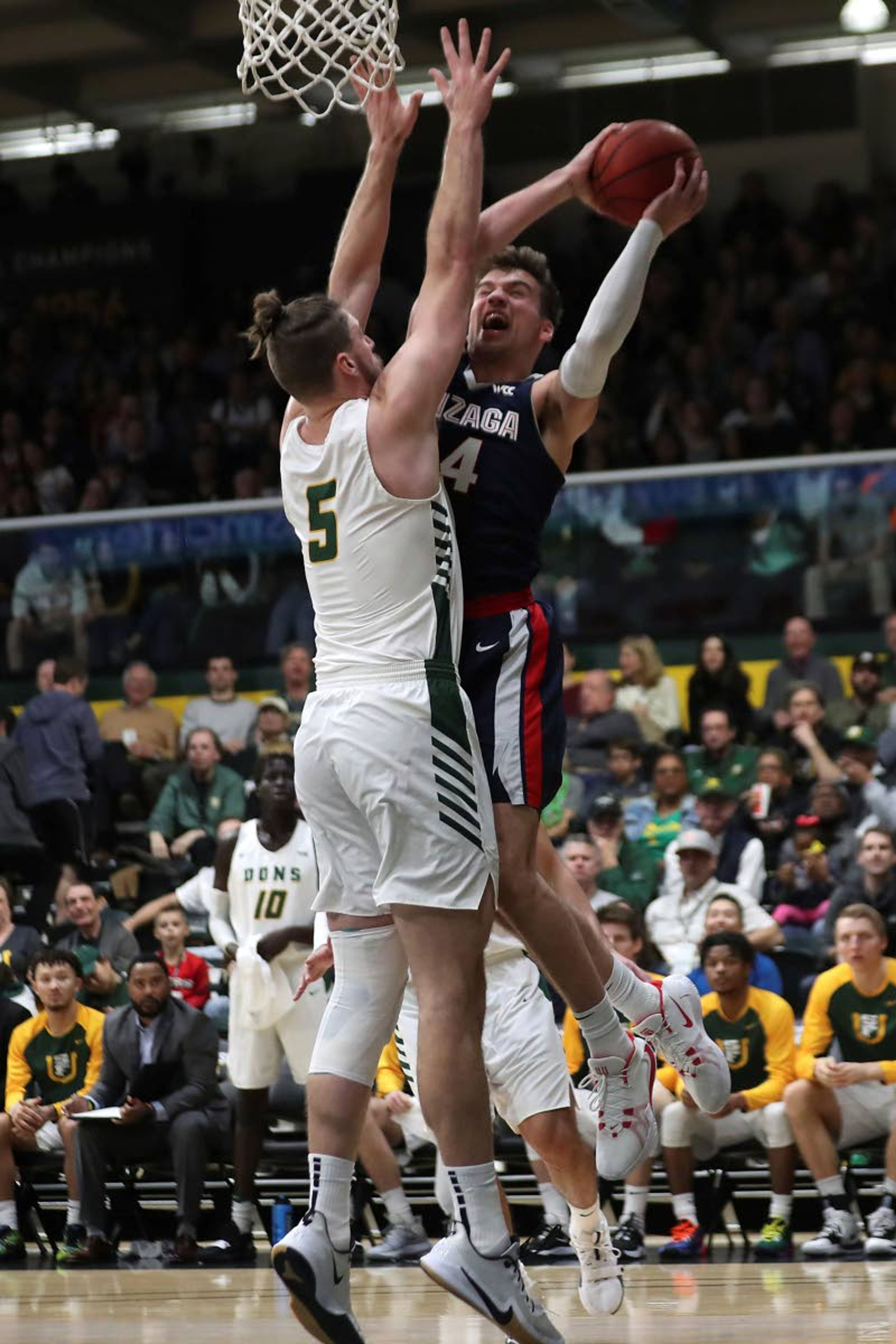 Gonzaga forward Corey Kispert (24) shoots against San Francisco center Jimbo Lull (5) during the first half of an NCAA college basketball game in San Francisco, Saturday, Feb. 1, 2020. (AP Photo/Jed Jacobsohn)