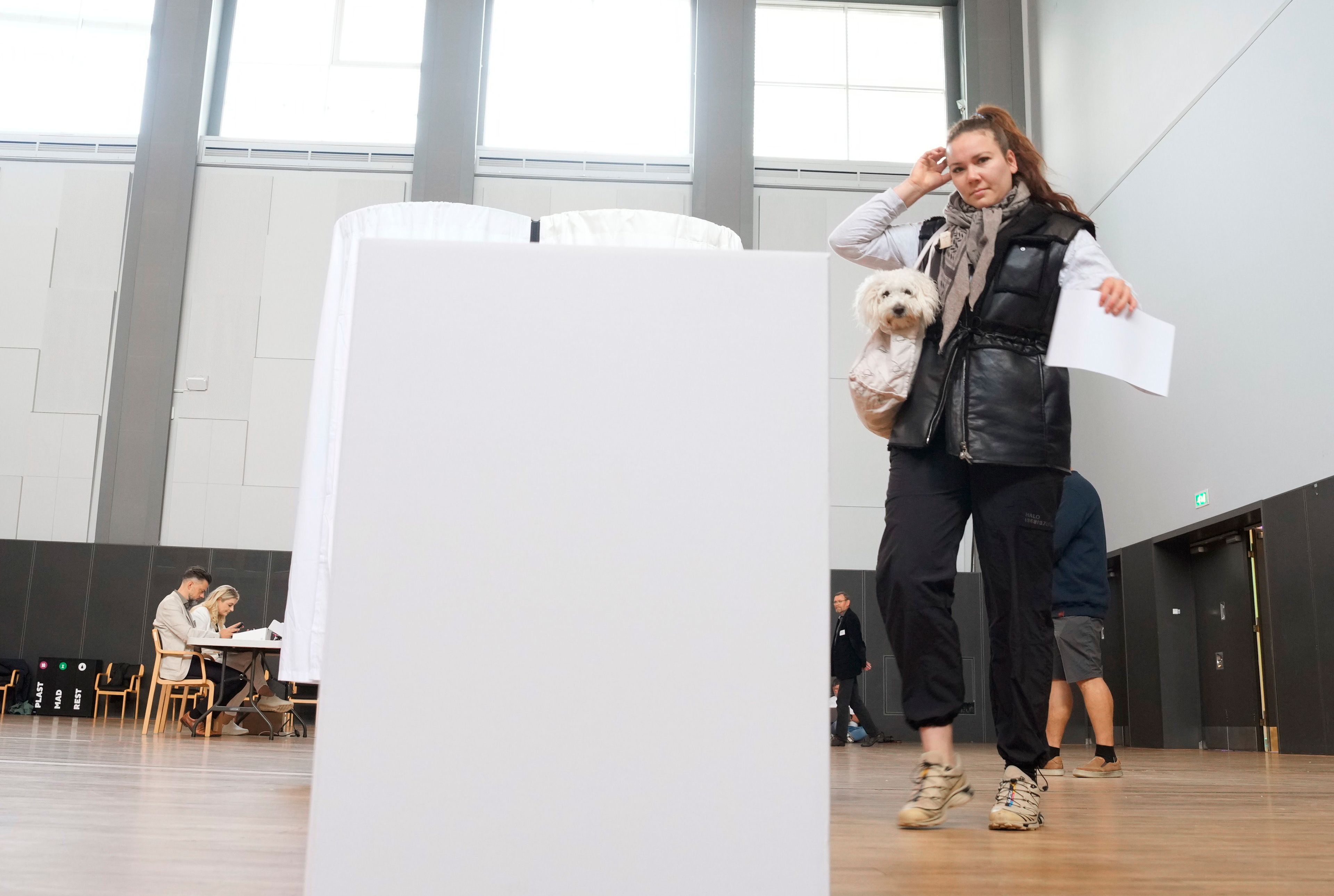 A woman prepares to cast her ballot for the European Parliament election, at the Aalborg Congress and Culture Center, in Aalborg, Denmark, Sunday, June 9, 2024. Polling stations have opened across Europe as voters from 20 countries cast ballots in elections that are expected to shift the European Union’s parliament to the right and could reshape the future direction of the world’s biggest trading bloc.