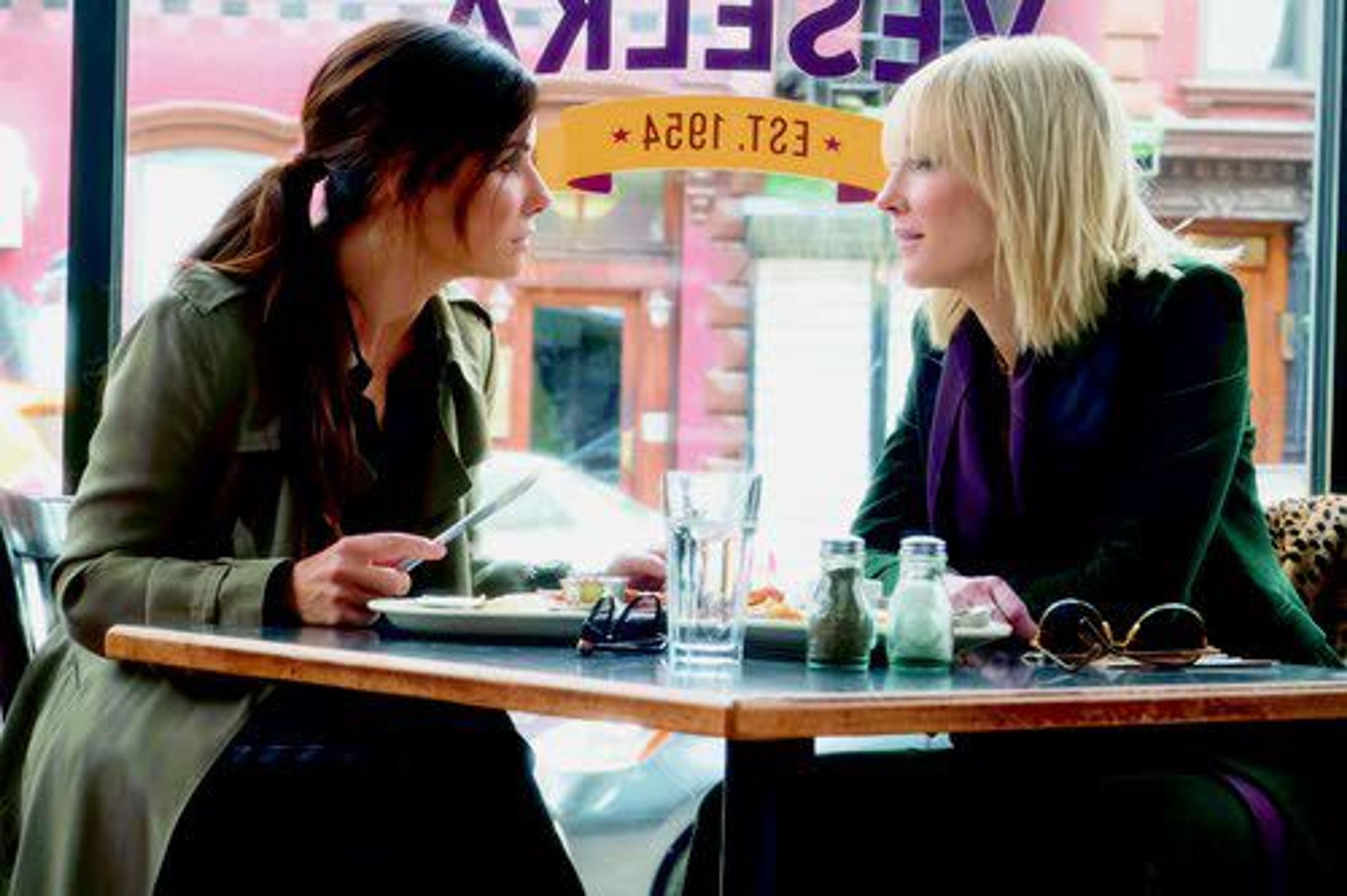 This image released by Warner Bros. shows Sandra Bullock (left) and Cate Blanchett in a scene from “Ocean’s 8.”