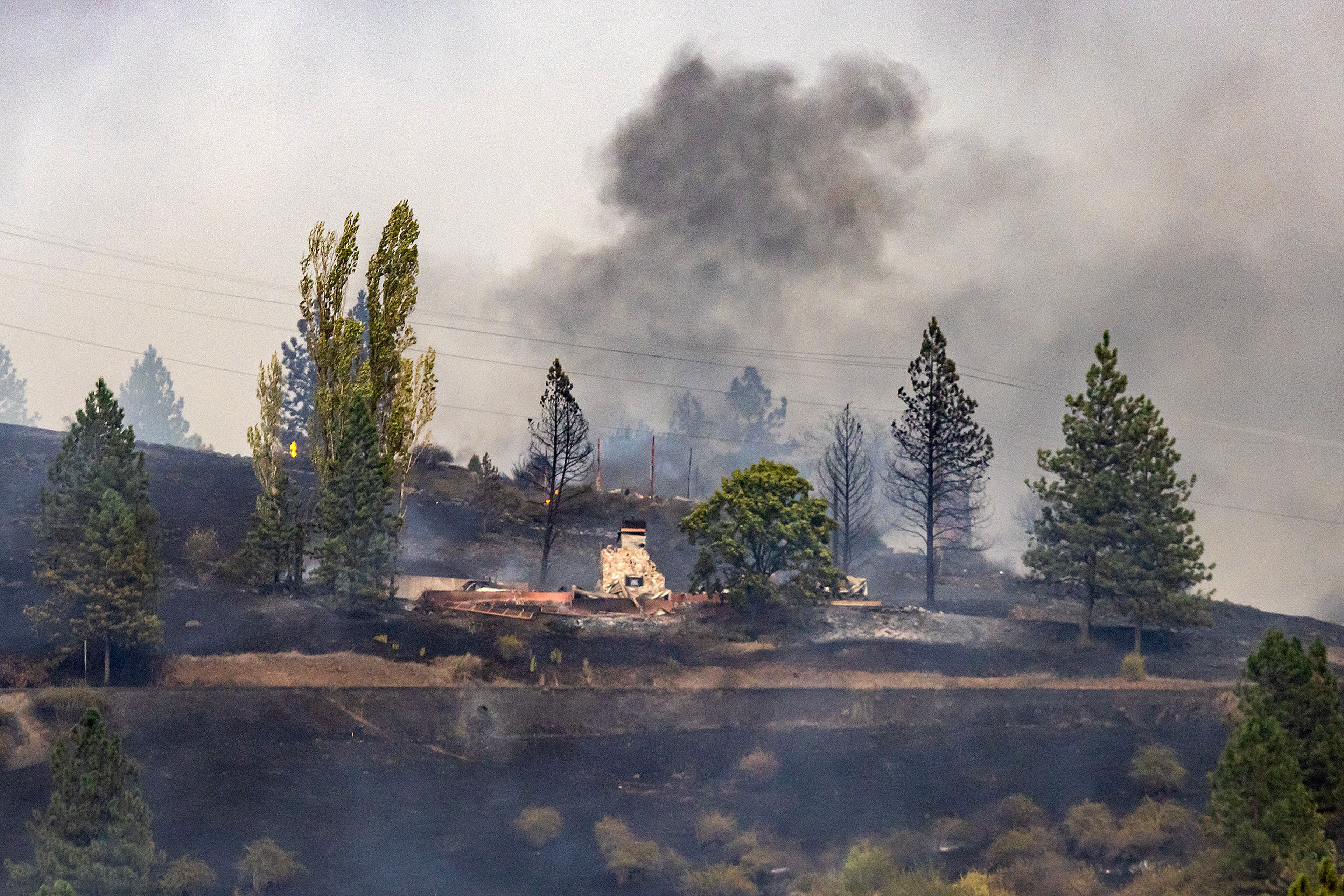 A fire burns off of Dent Bridge Road Tuesday near Orofino.