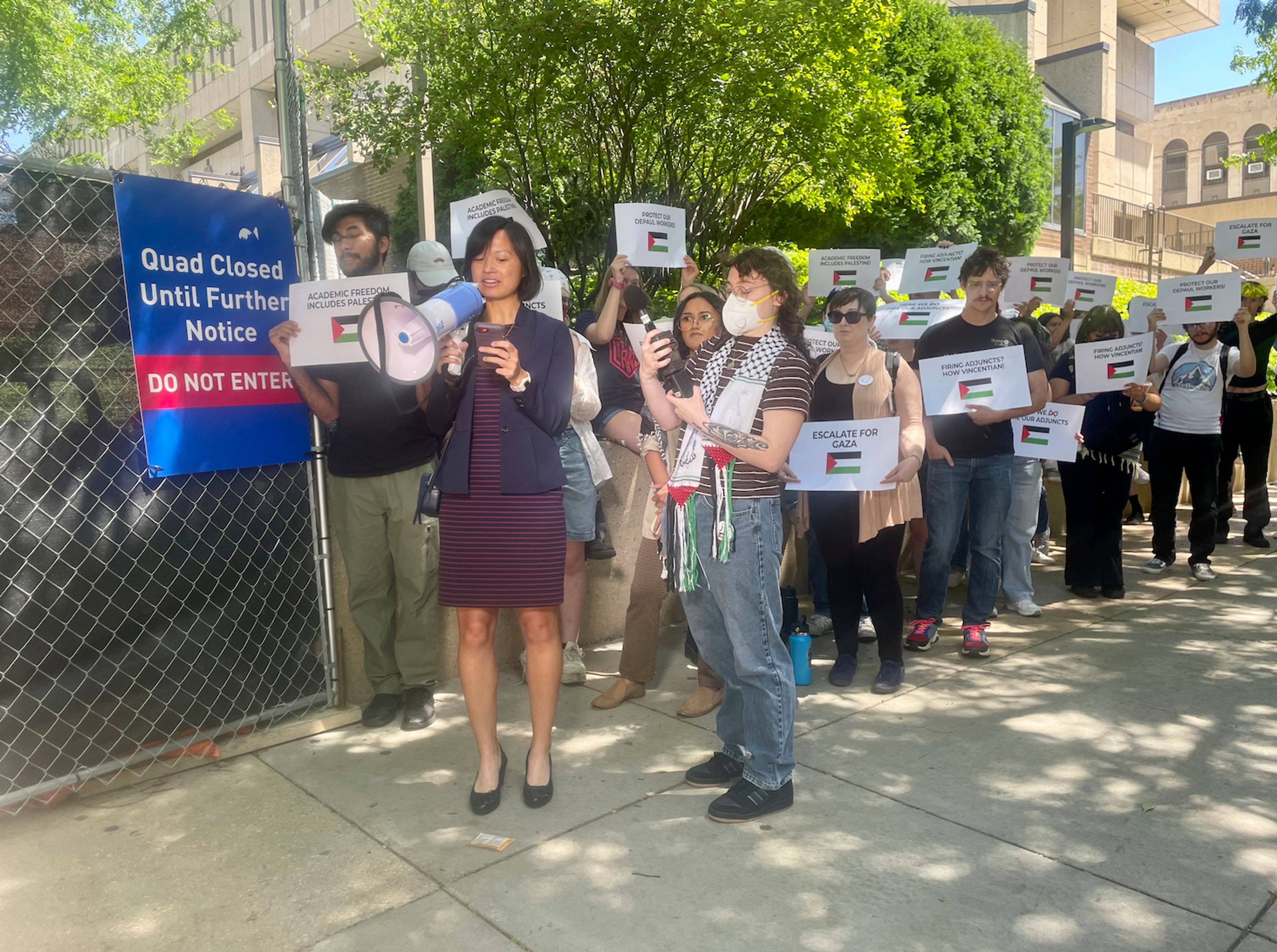 DePaul University adjunct professor Anne d'Aquino speaks to reporters with pro-Palestinian demonstrators standing behind her outside the North Side university's quad, Thursday, June 6, 2024.