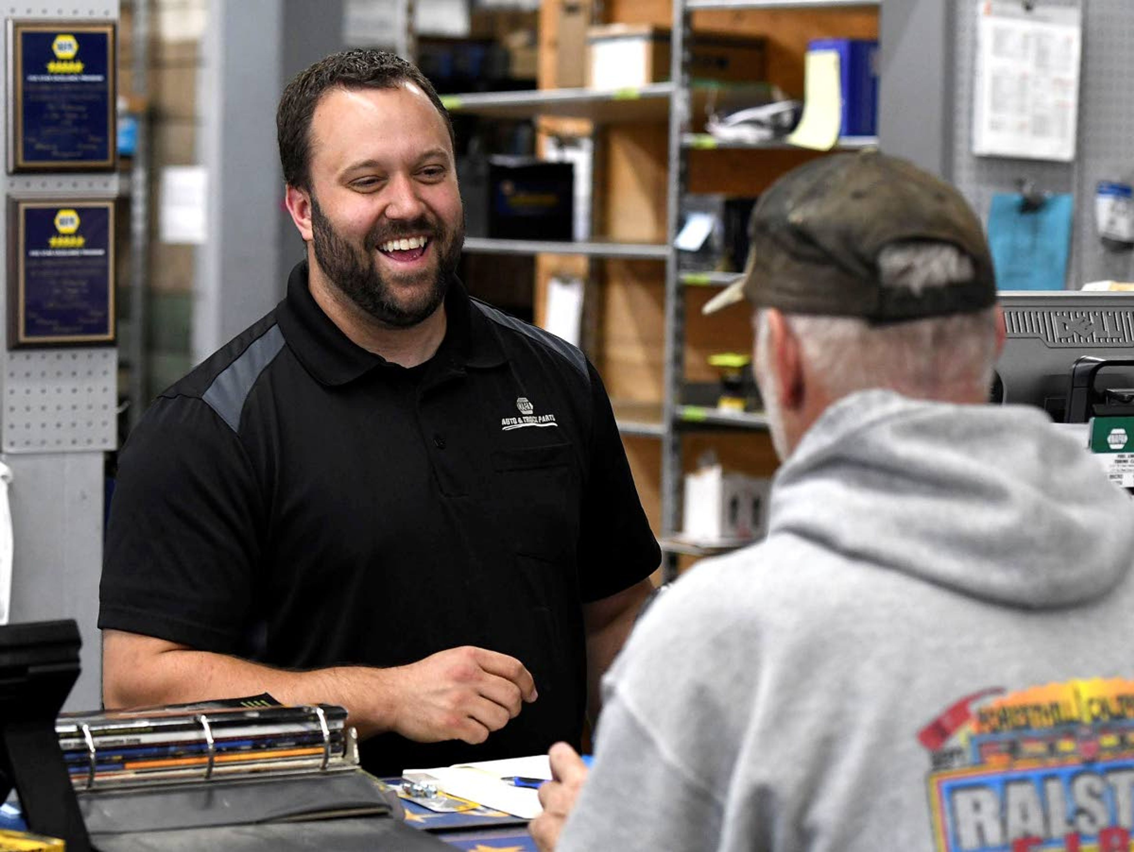 Cory Koole has a laugh with a customer after finding the right parts for him.